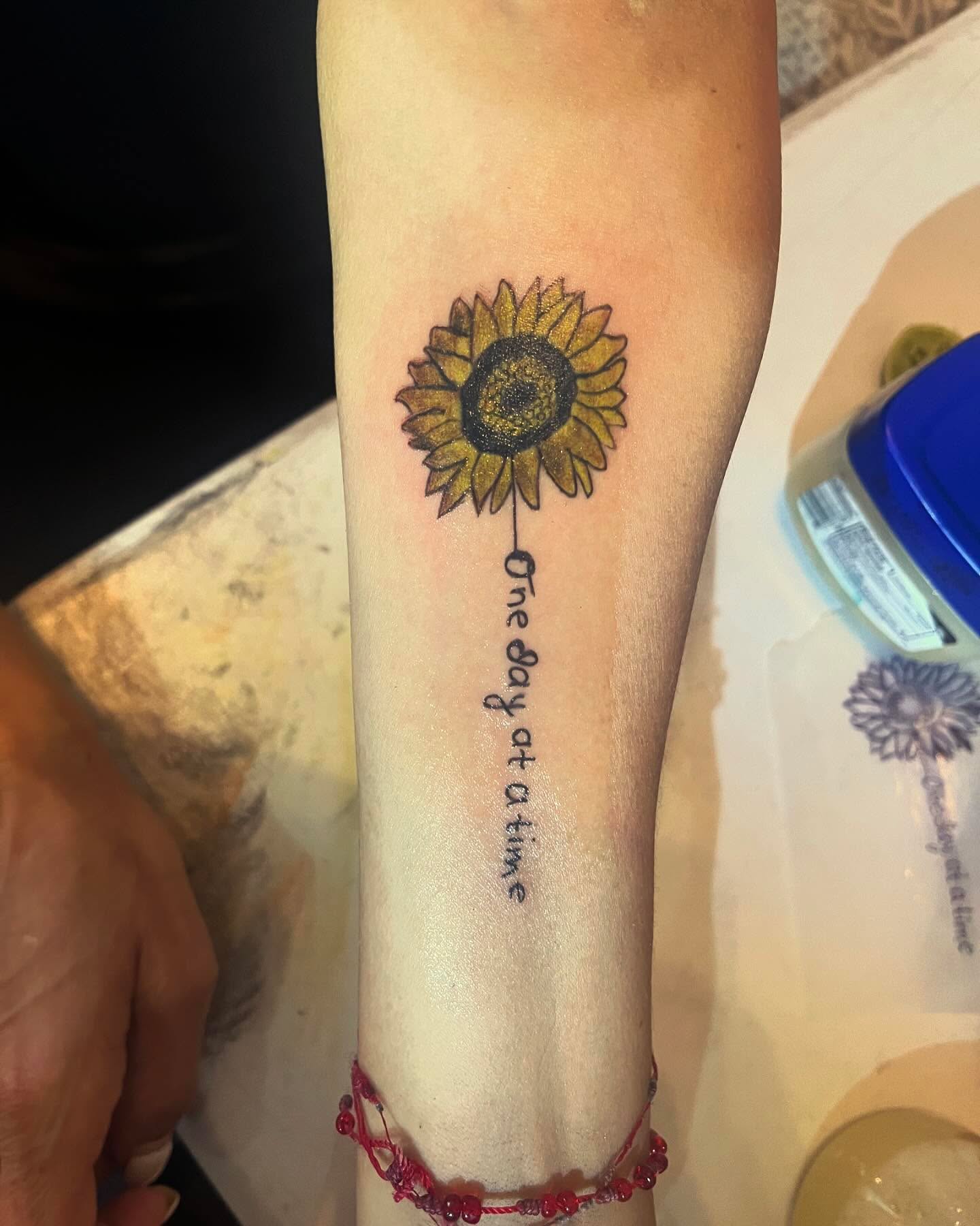 Sunflower dotwork tattoo on the forearm by Anna DeLuna
