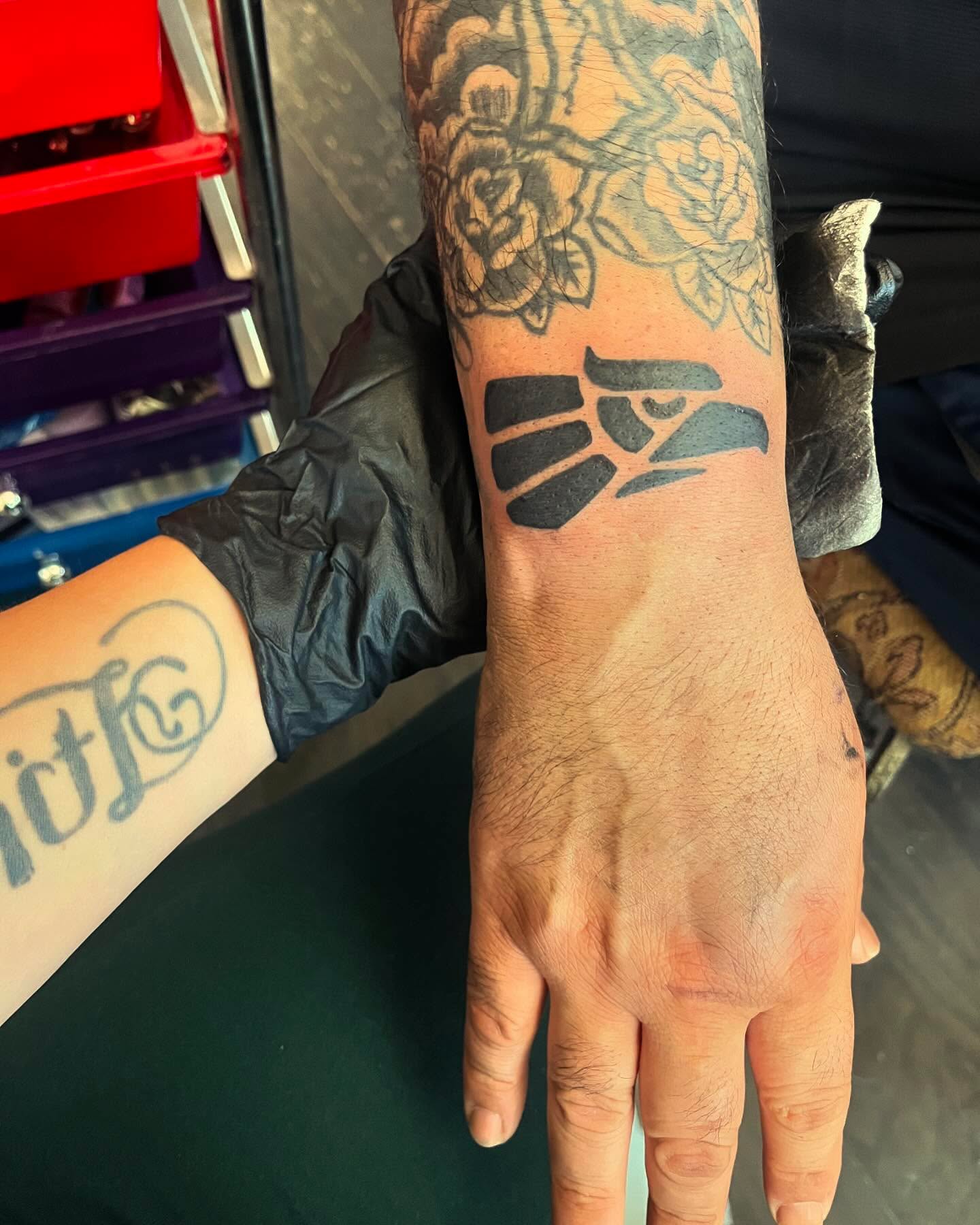 Fist black and grey tattoo on the forearm by Anna DeLuna