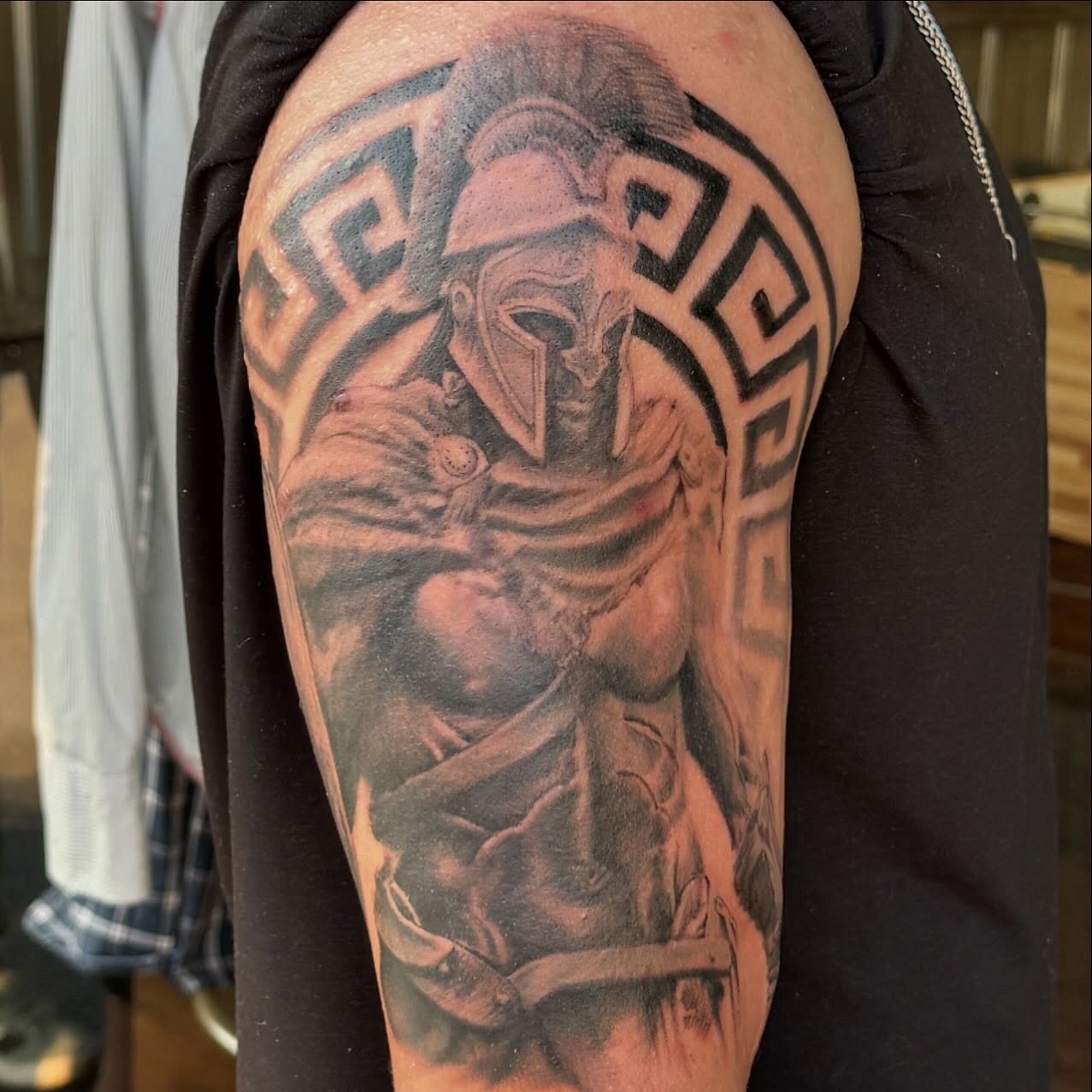 Spartan warrior realism tattoo on the shoulder by Kyle J. Bishop