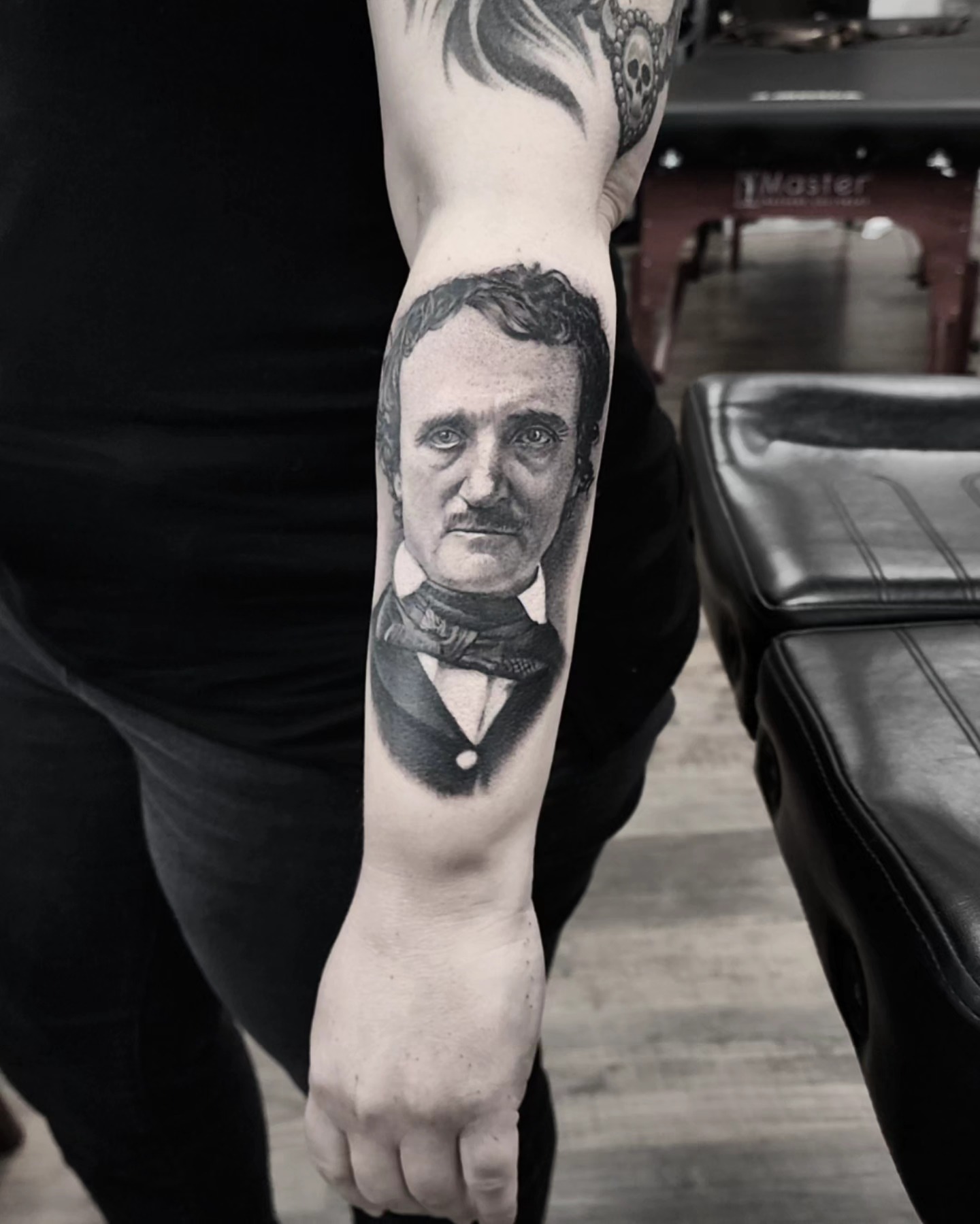 Edgar Allan Poe realism tattoo on the forearm by Dani Ryan