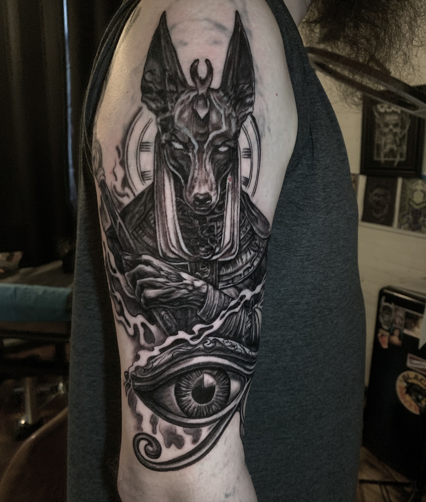 Ancient god with eye realism tattoo on the forearm by Phil Robertson
