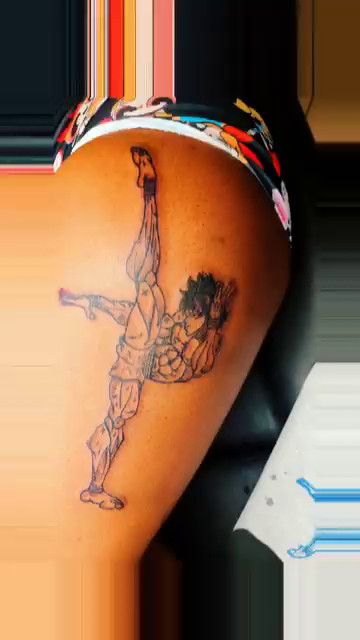 Martial artist in a dynamic pose new school tattoo on the thigh by Lopez Dautruche