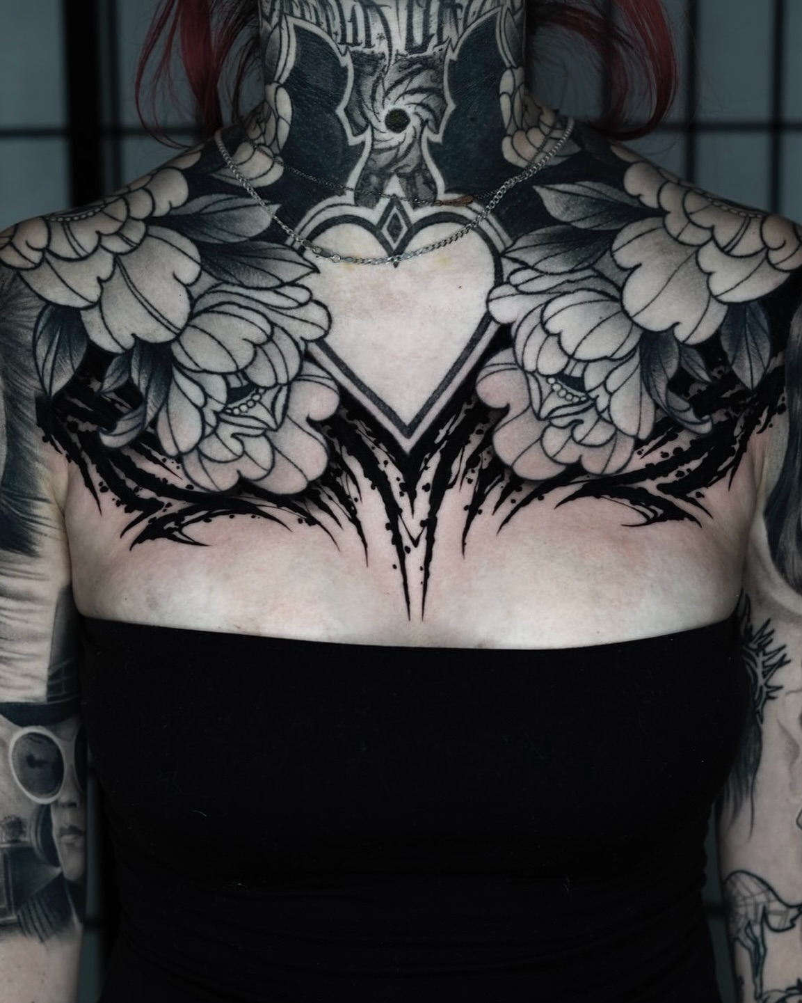 Heart with wings geometric tattoo on the chest by Nathan