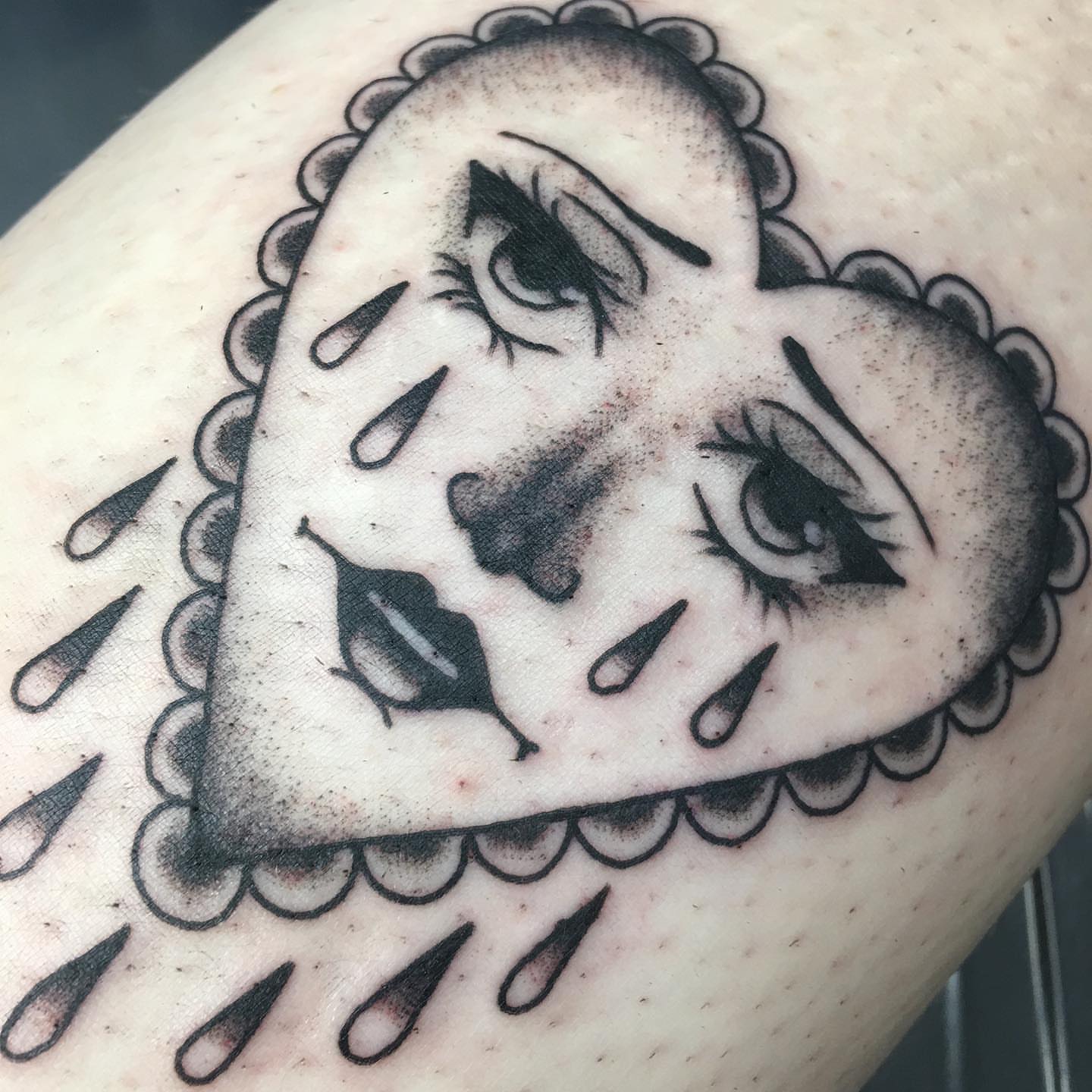 Tearful face black and grey tattoo on the forearm by Abbey Martin, Nashville, Tennessee