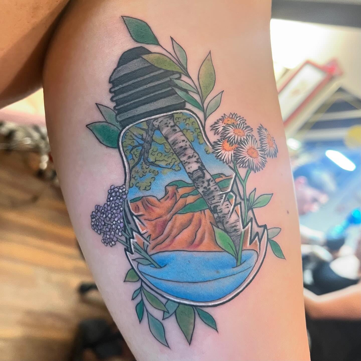 Landscape in light bulb American traditional tattoo on the forearm by Krystal ✨