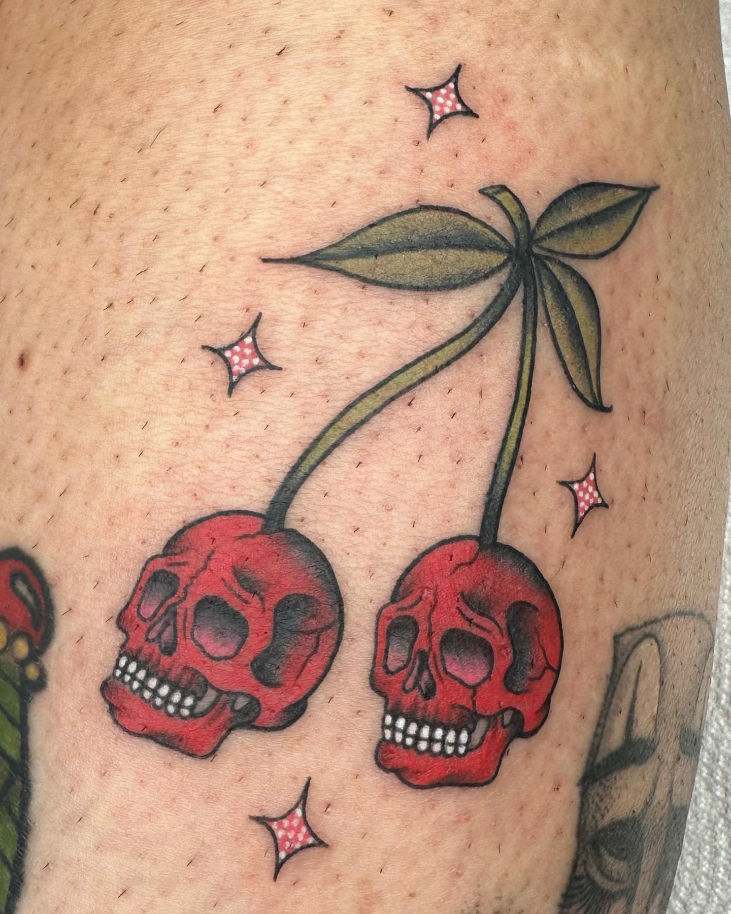 Skulls and cherries American traditional tattoo on the forearm by ⭒ ʜᴀɪʟᴇʏ ᴍᴇᴛᴢ ⭒