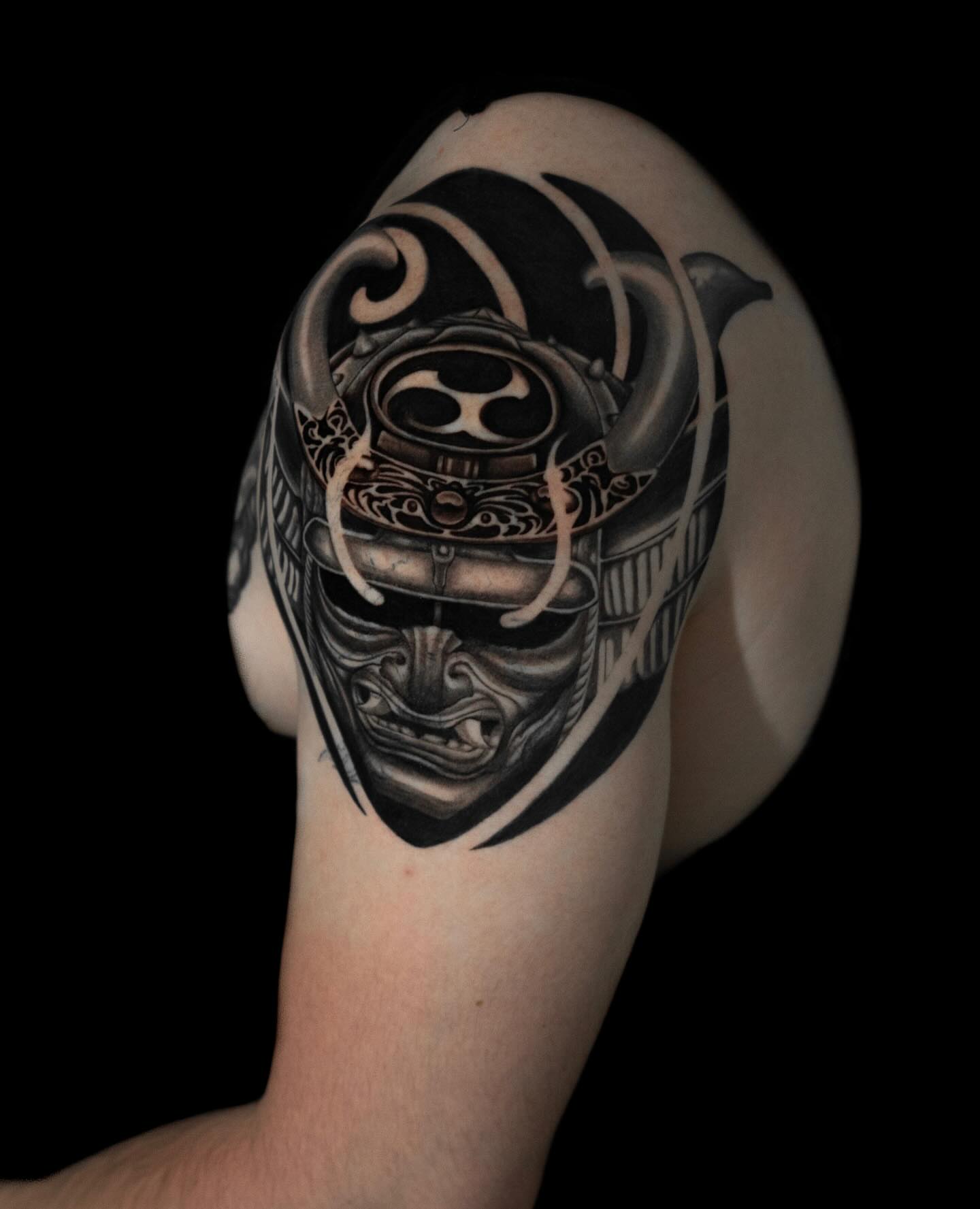Samurai helmet realism tattoo on the shoulder by Tattoo Artist