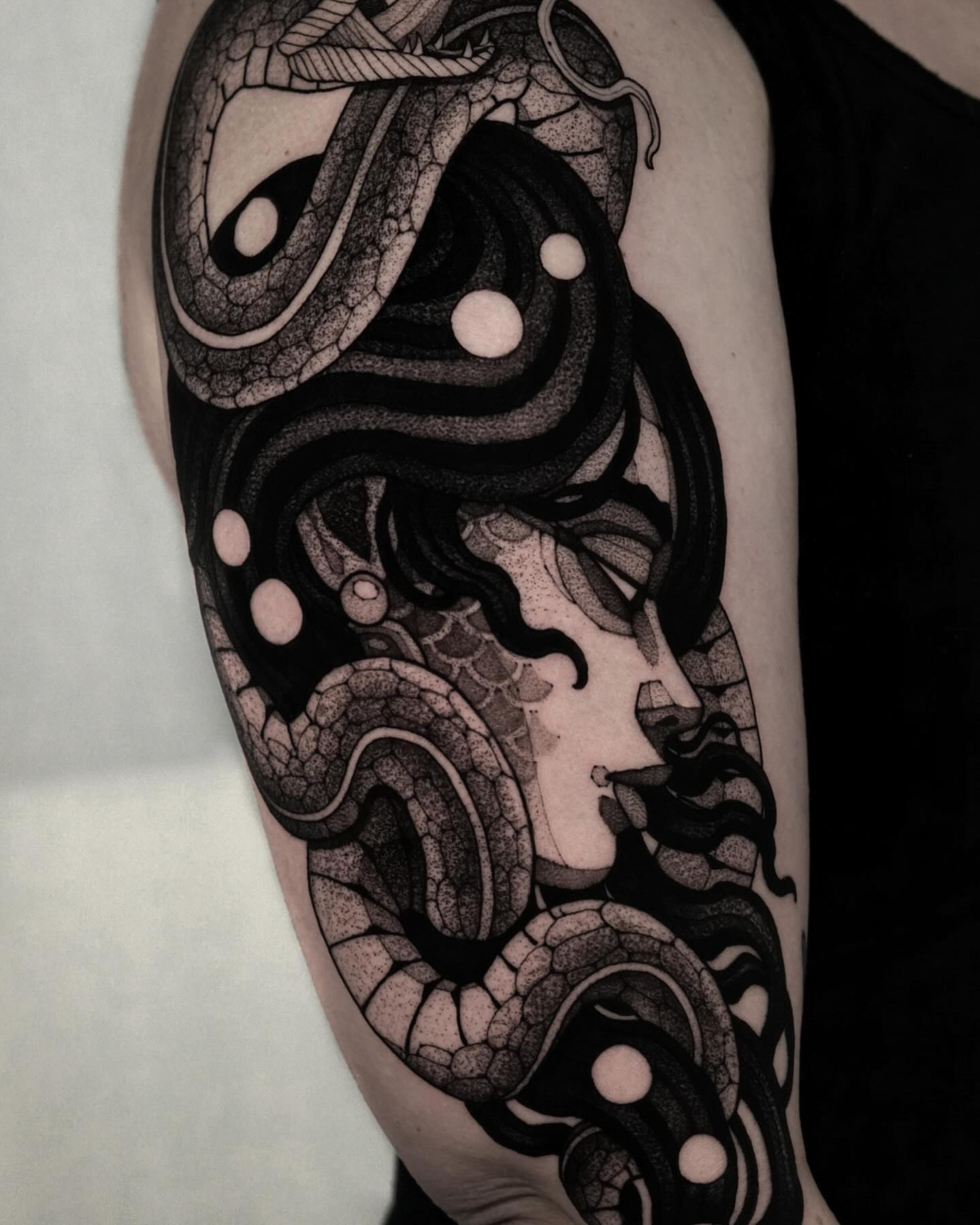 Woman with snakes dotwork tattoo on the forearm by Max LaCroix