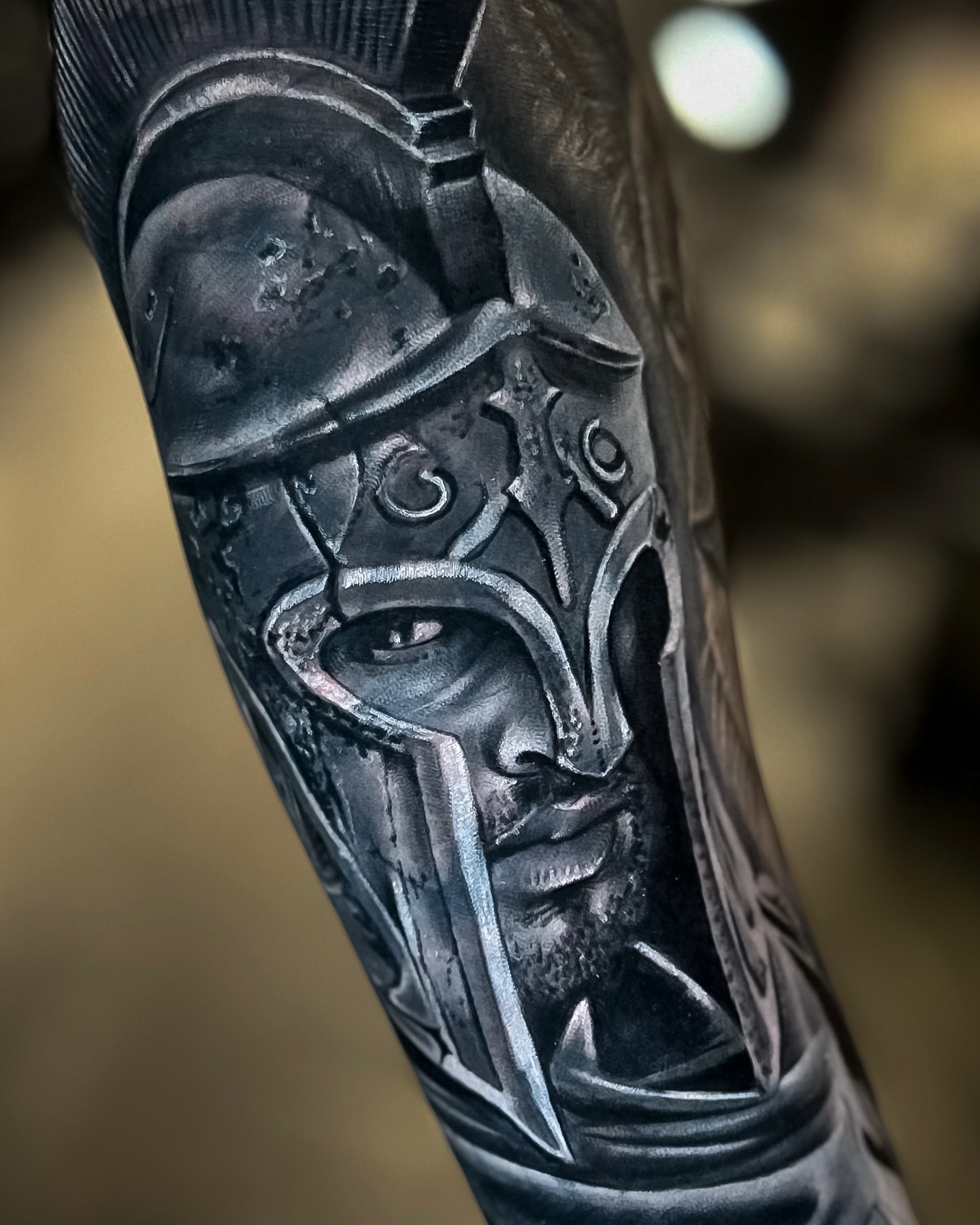 Helmeted warrior realism tattoo on the forearm by Luis Manuel Olivera, North Miami, Florida