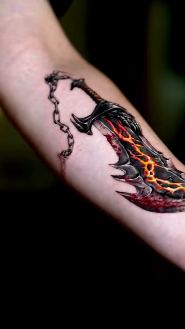 Fiery sword with chain realism tattoo by Eun, Toronto, Ontario