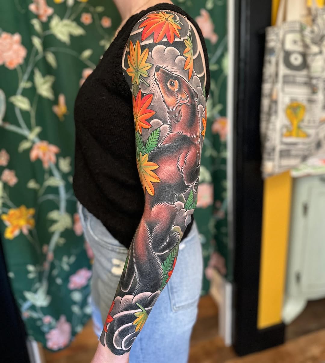 Ferret and maple leaves Japanese tattoo on the forearm by Megon Shore, Seattle, Washington