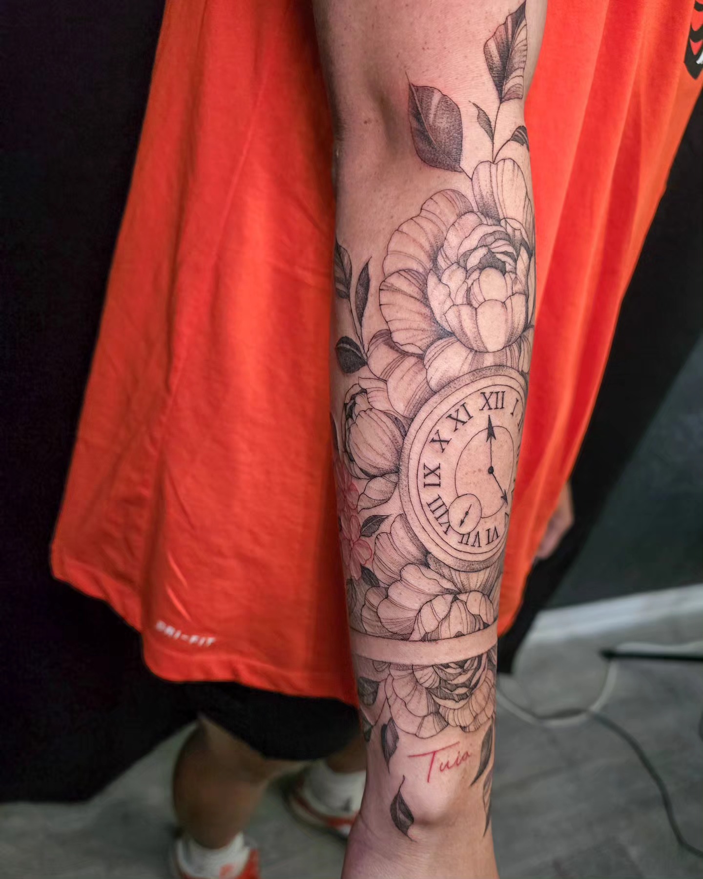 Clock and flowers realism tattoo on the forearm by Utah Tattoo Artist