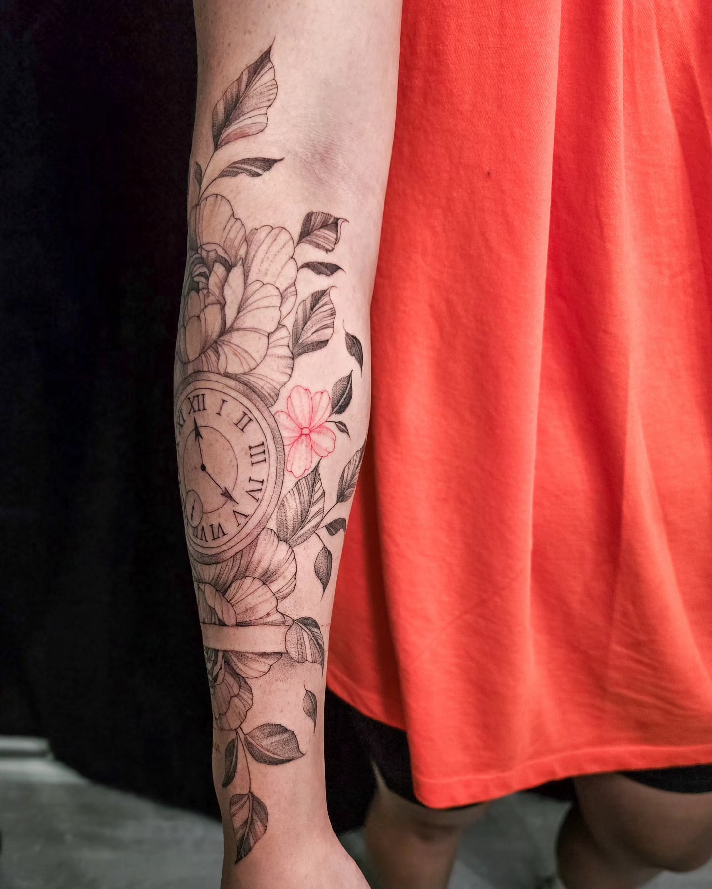 Clock and floral realism tattoo on the forearm by Utah Tattoo Artist