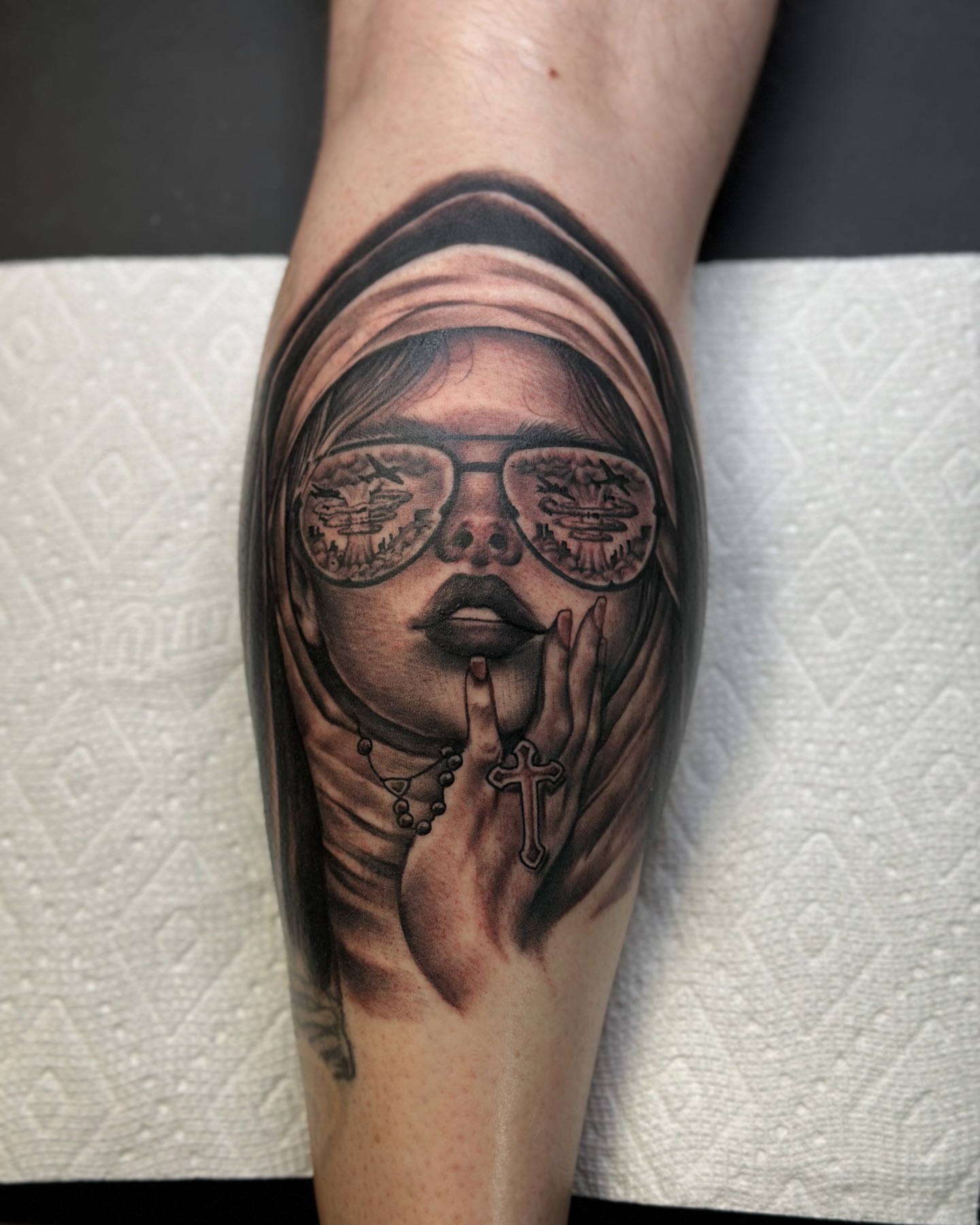 Woman with sunglasses realism tattoo on the forearm by Calvin Maryland 🇵🇹