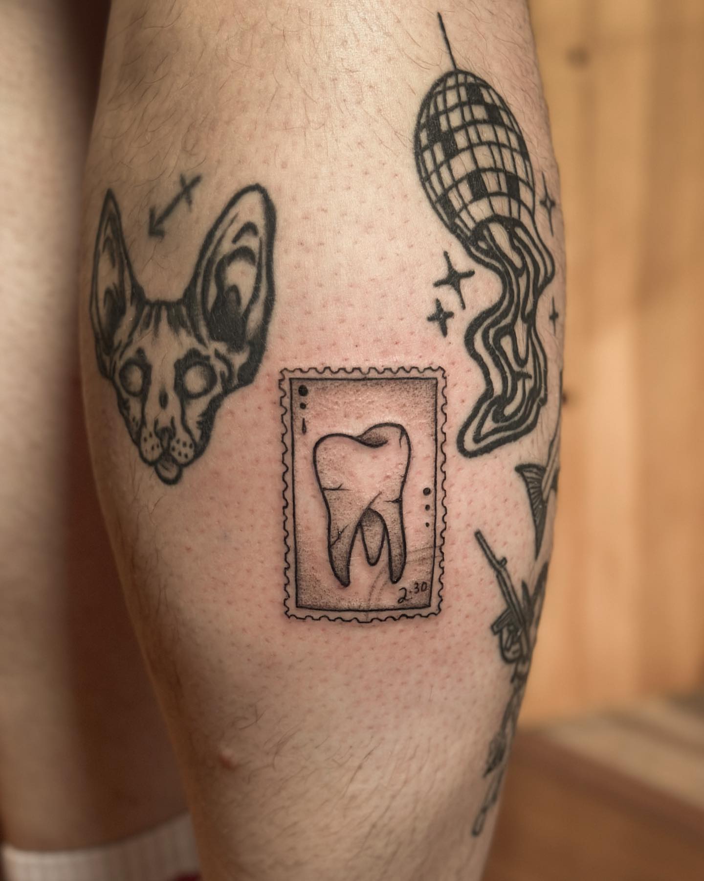 Tooth stamp black and grey tattoo on the forearm by πππππππππ β ππππ ππππ ππππ ππππππ ππππππ, Salt Lake City, Utah