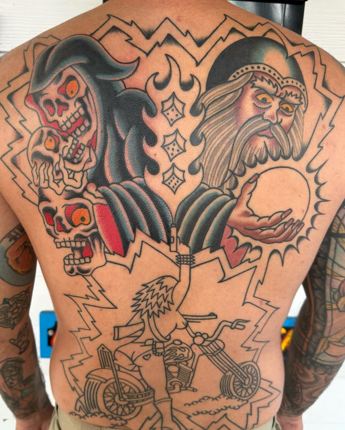 Skulls and wizard American traditional tattoo on the back by James Shepherd, Austin, Texas