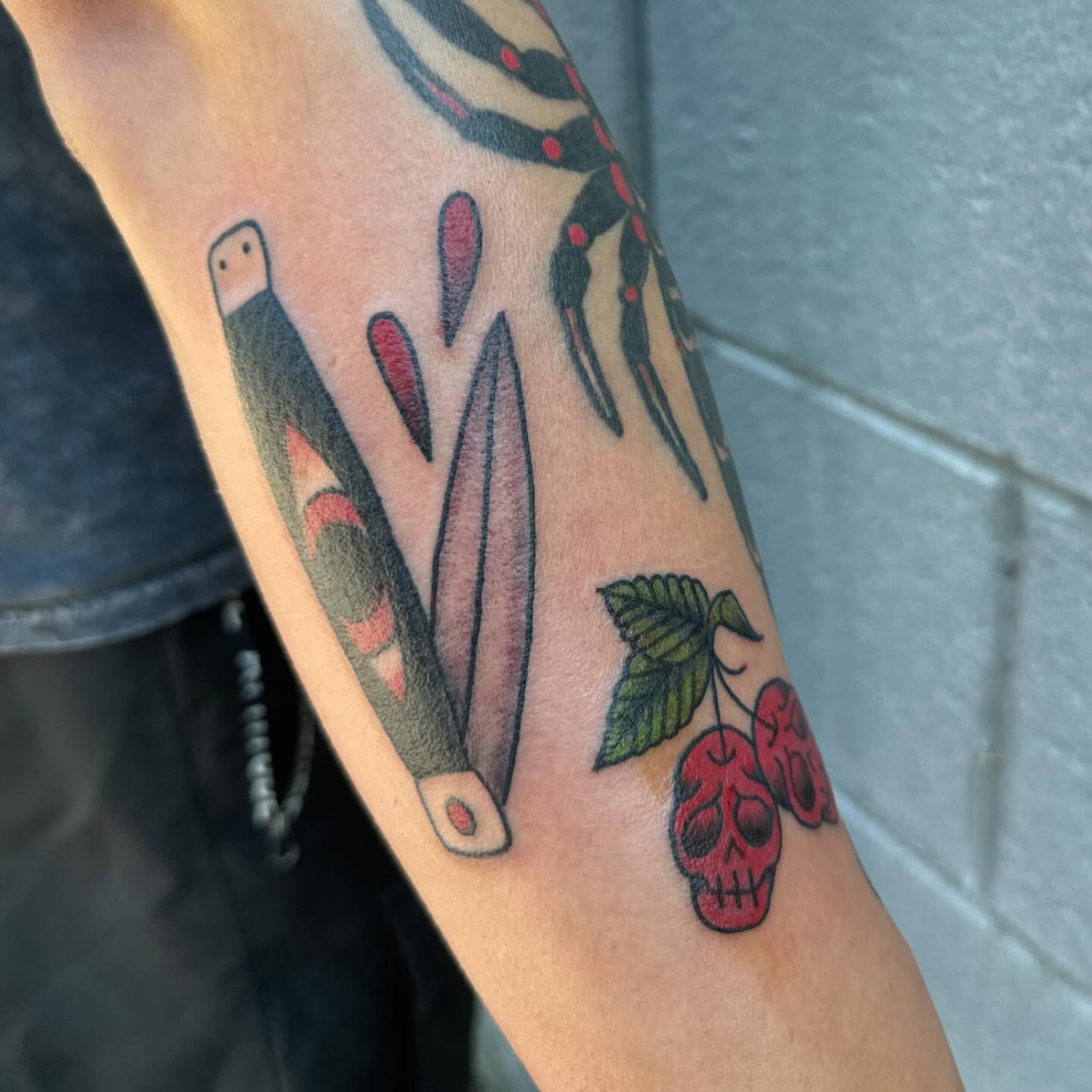 Cherry skull American traditional tattoo on the forearm by 👾 not ur baby’s ink 👾