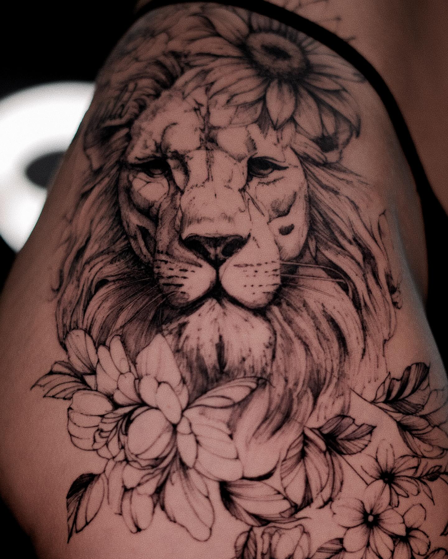 Lion realism tattoo on the shoulder by Ron Alvarez