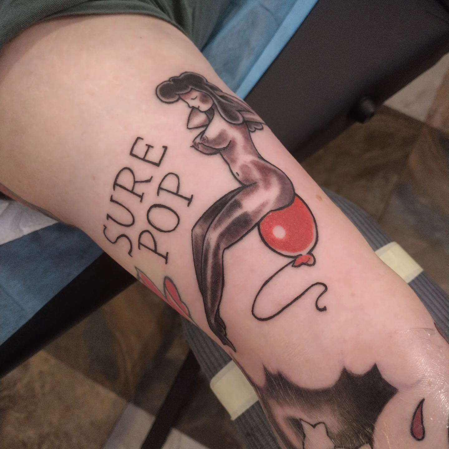 Balloon and woman black and grey tattoo on the forearm by Matt Williamson