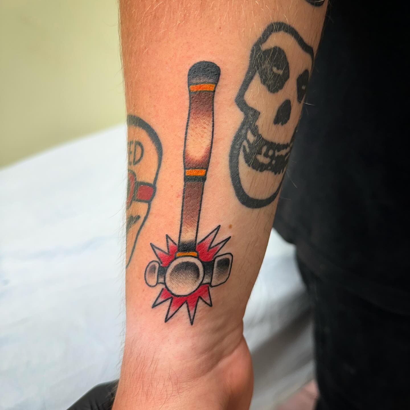 Hammer and mallet American traditional tattoo on the forearm by Ethan Bennett