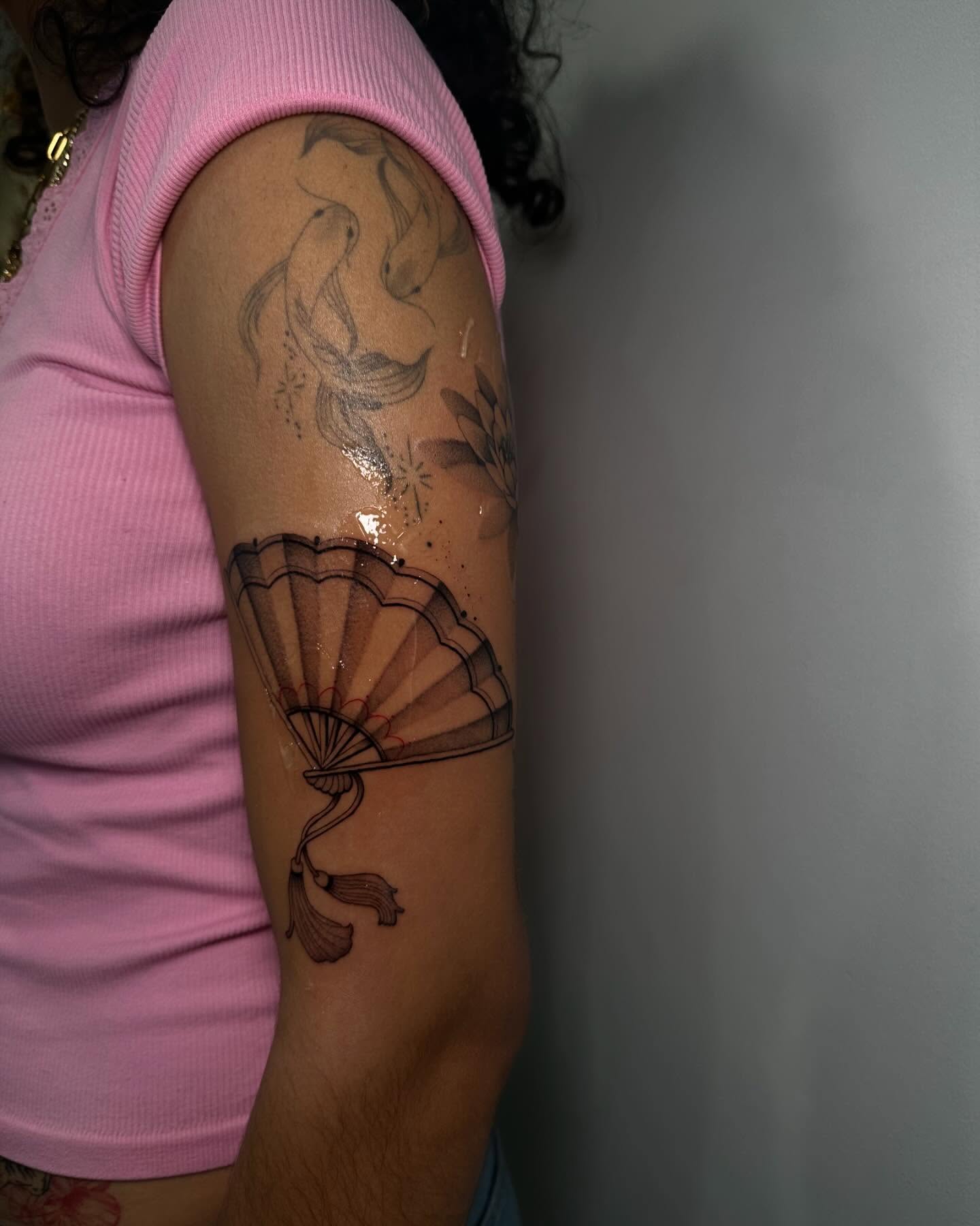 Fan black and grey tattoo on the forearm by @piinkywabbiit, Roselle Park, New Jersey
