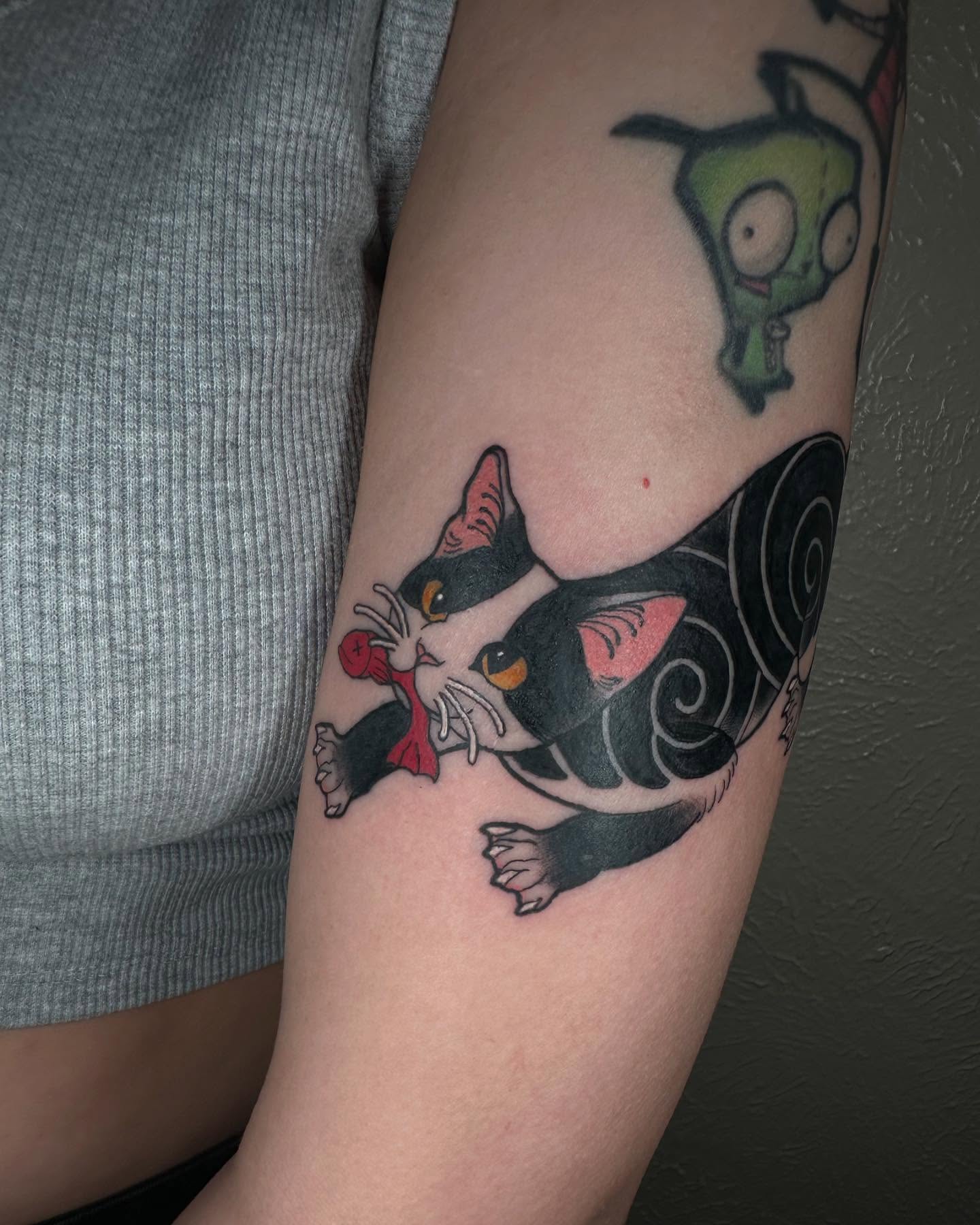 Cat American traditional tattoo on the forearm by Lexi Wilkinson