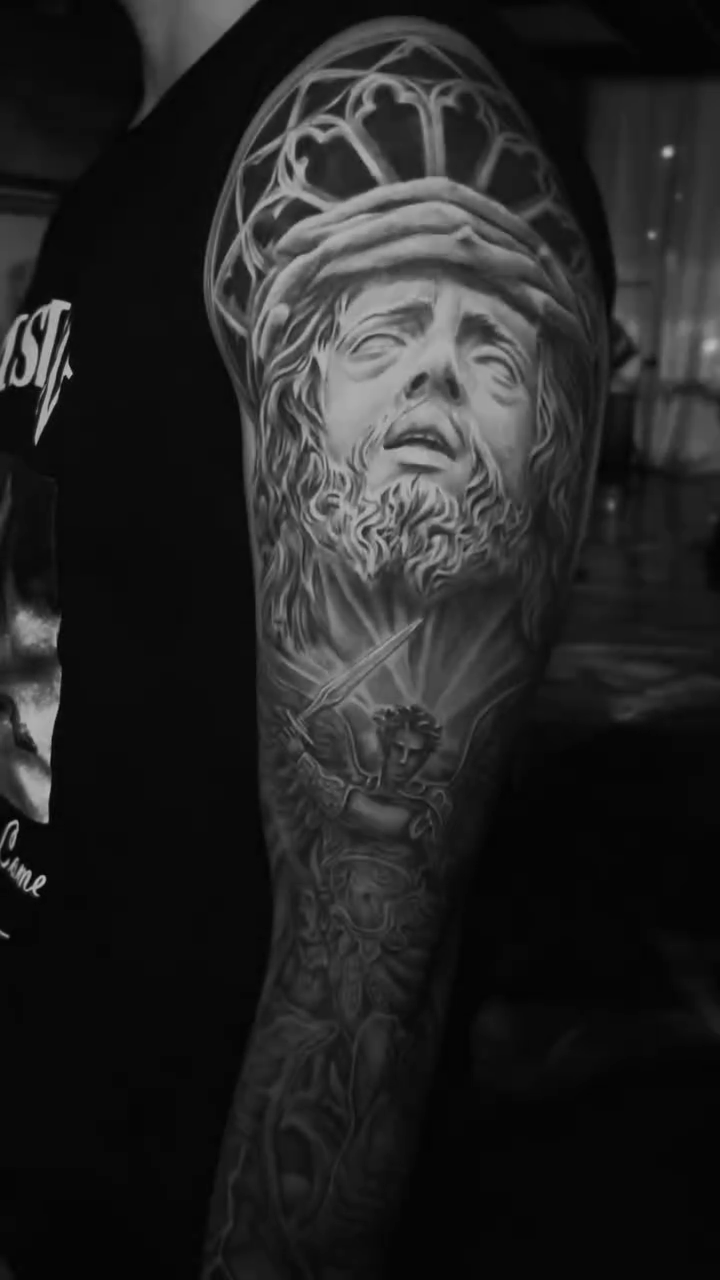Statue of a man and angel realism tattoo by Las Vegas Tattoo Artist