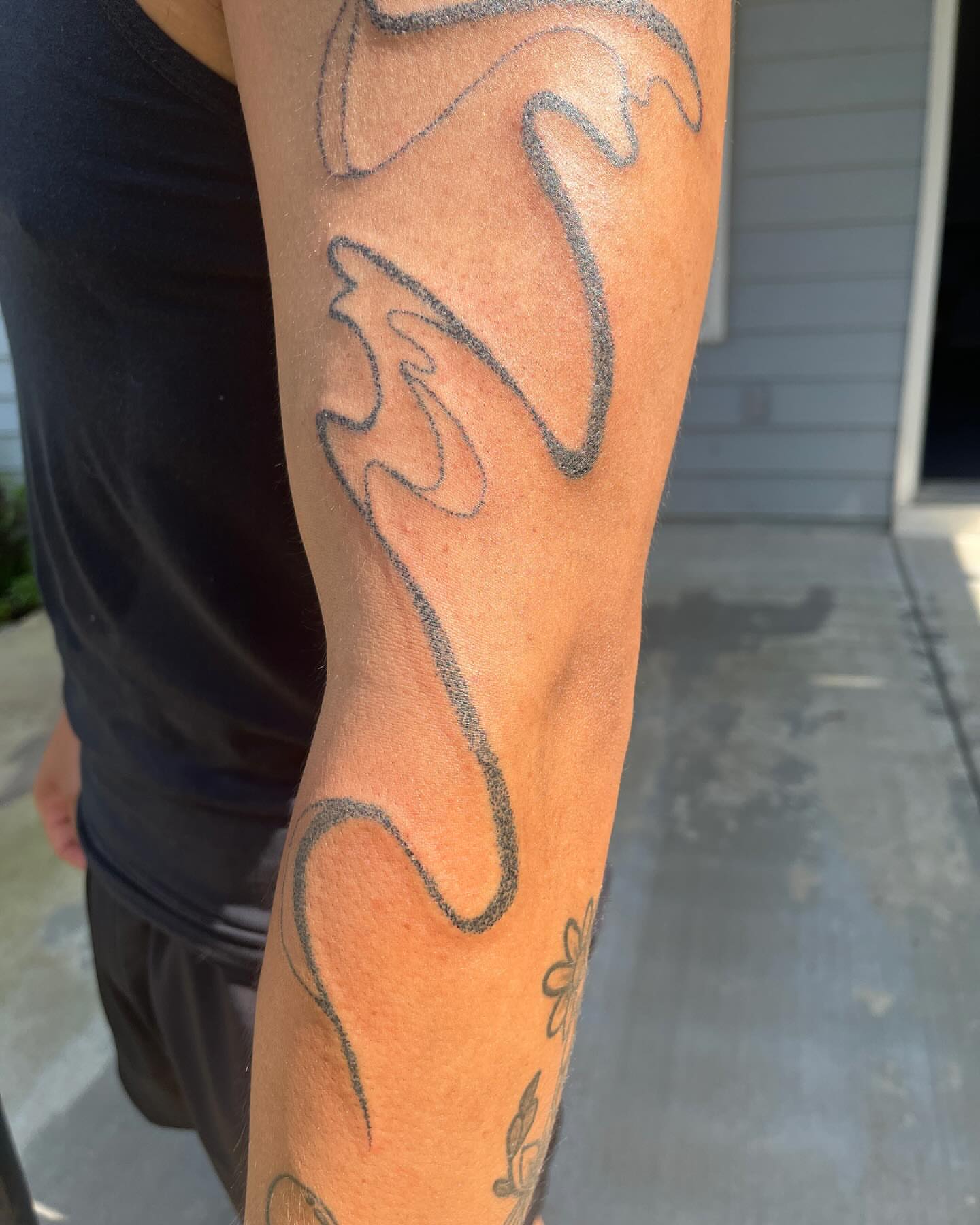 Abstract flame black and grey tattoo on the forearm by hana