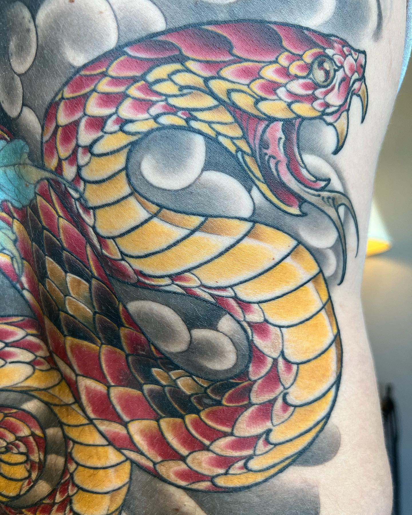 Snake American traditional tattoo on the thigh by Byron Winkelman, Gilbert, Arizona