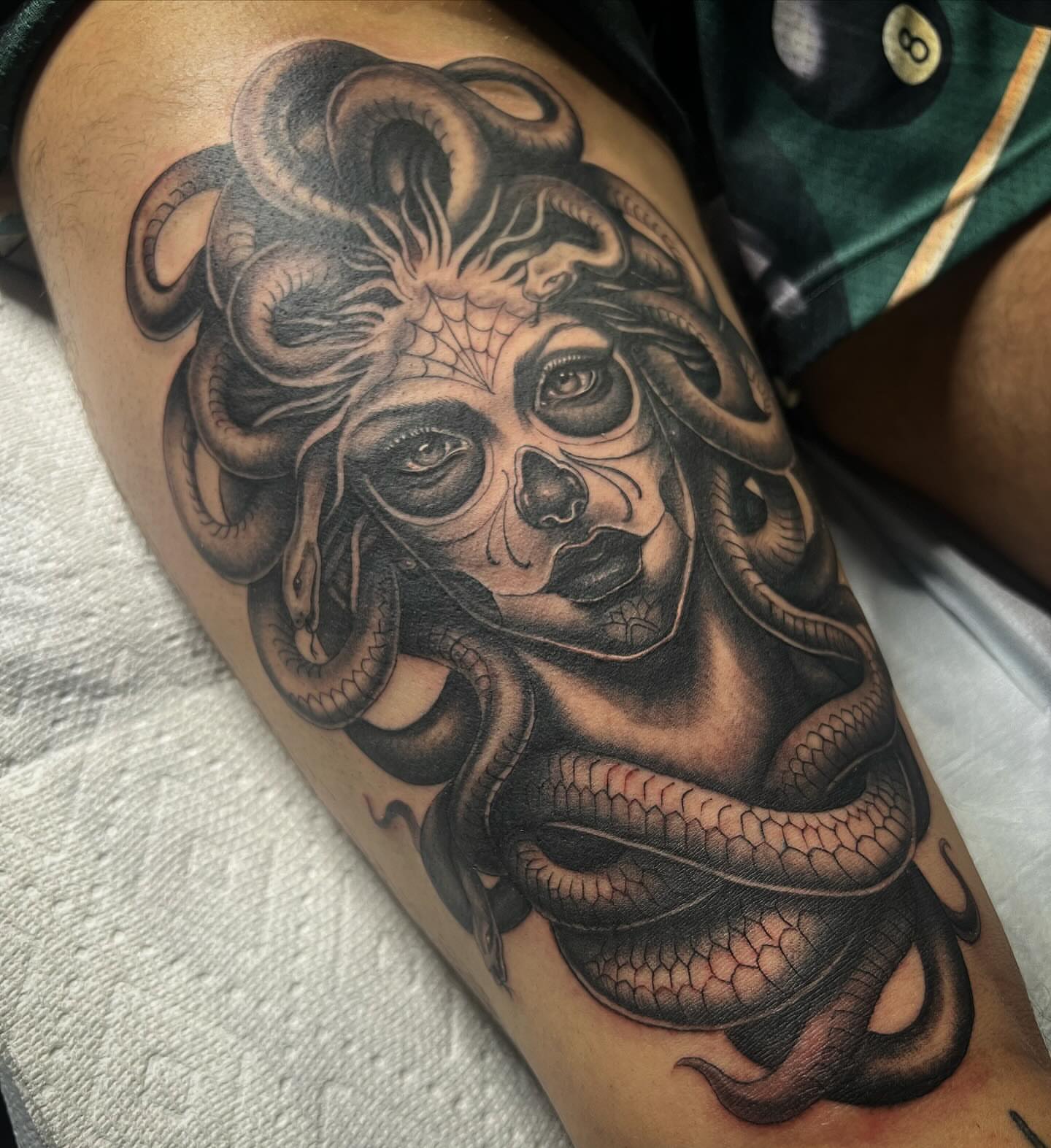 Medusa realism tattoo on the thigh by Niz Carrillo