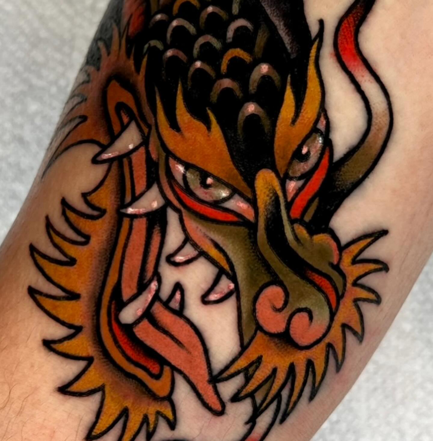 Dragon American traditional tattoo on the forearm by Hailey Johnson