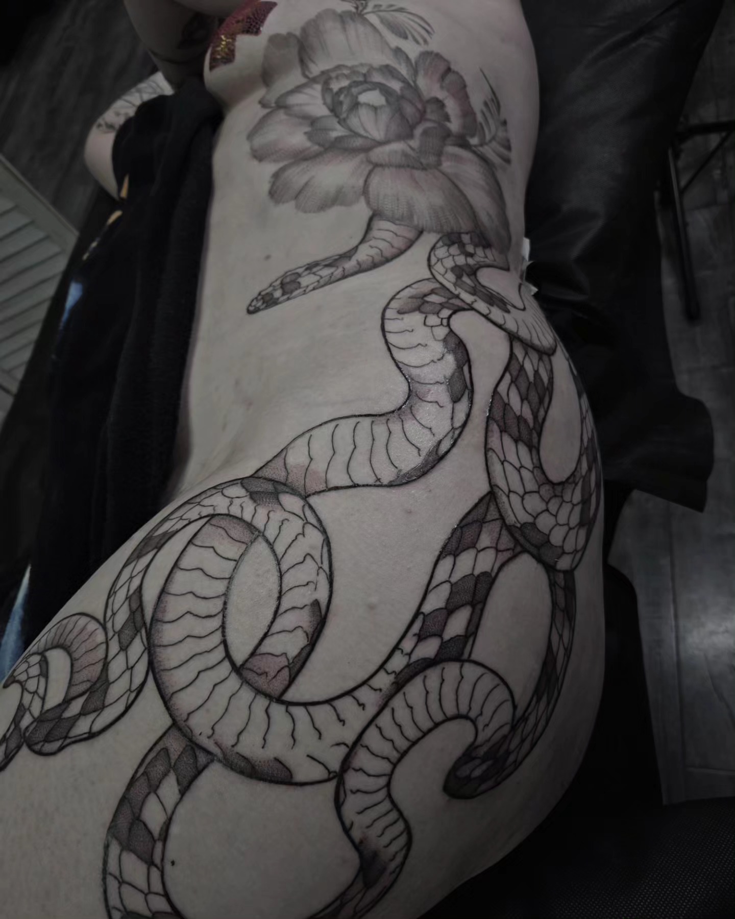 Snake and peony black and grey tattoo on the thigh by Gabrielle Esperanza ☽。⋆