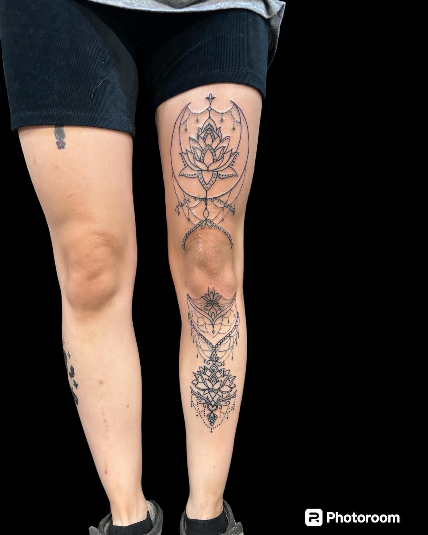 Lotus flower dotwork tattoo on the calf by Dale Martin