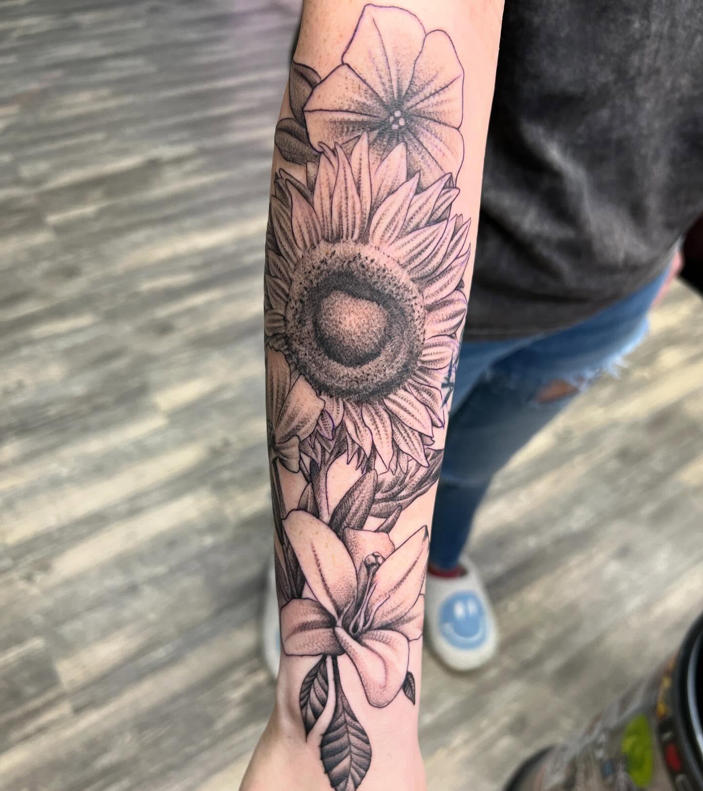 Sunflower and lily black and grey tattoo on the forearm by Dustin Quillen Tattoo Artist, Campbellsville, Kentucky