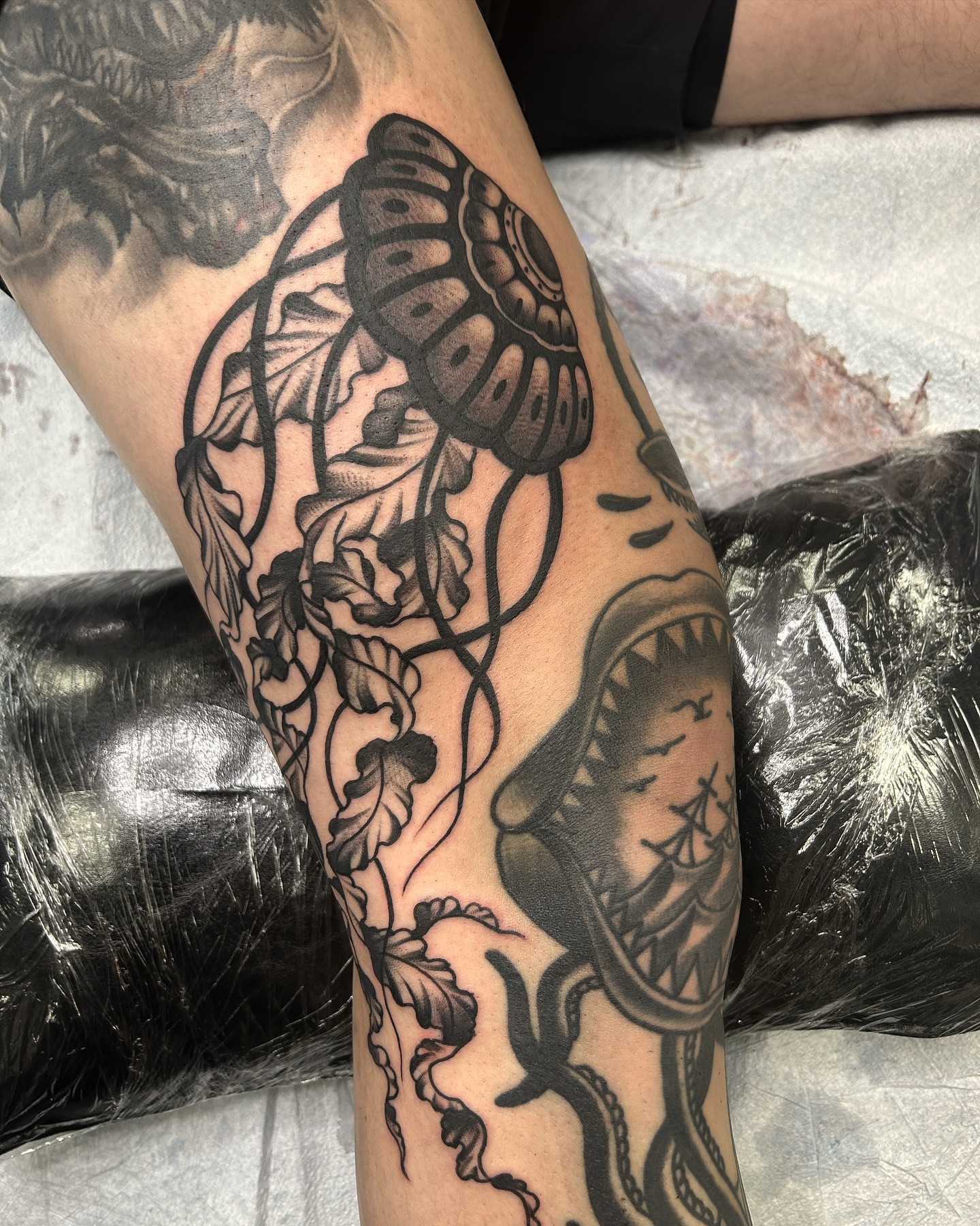 Butterfly and shark American traditional tattoo on the forearm by Jade McKenzie, Temecula, California