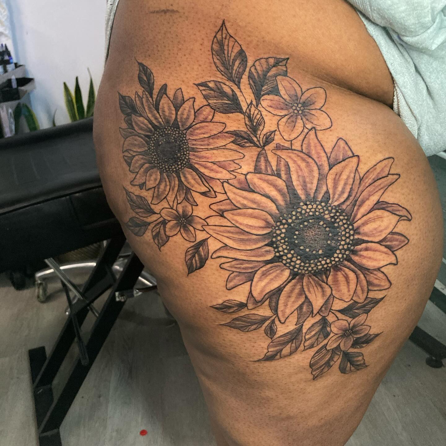 Sunflowers dotwork tattoo on the thigh by Detroit Tattoo Artist
