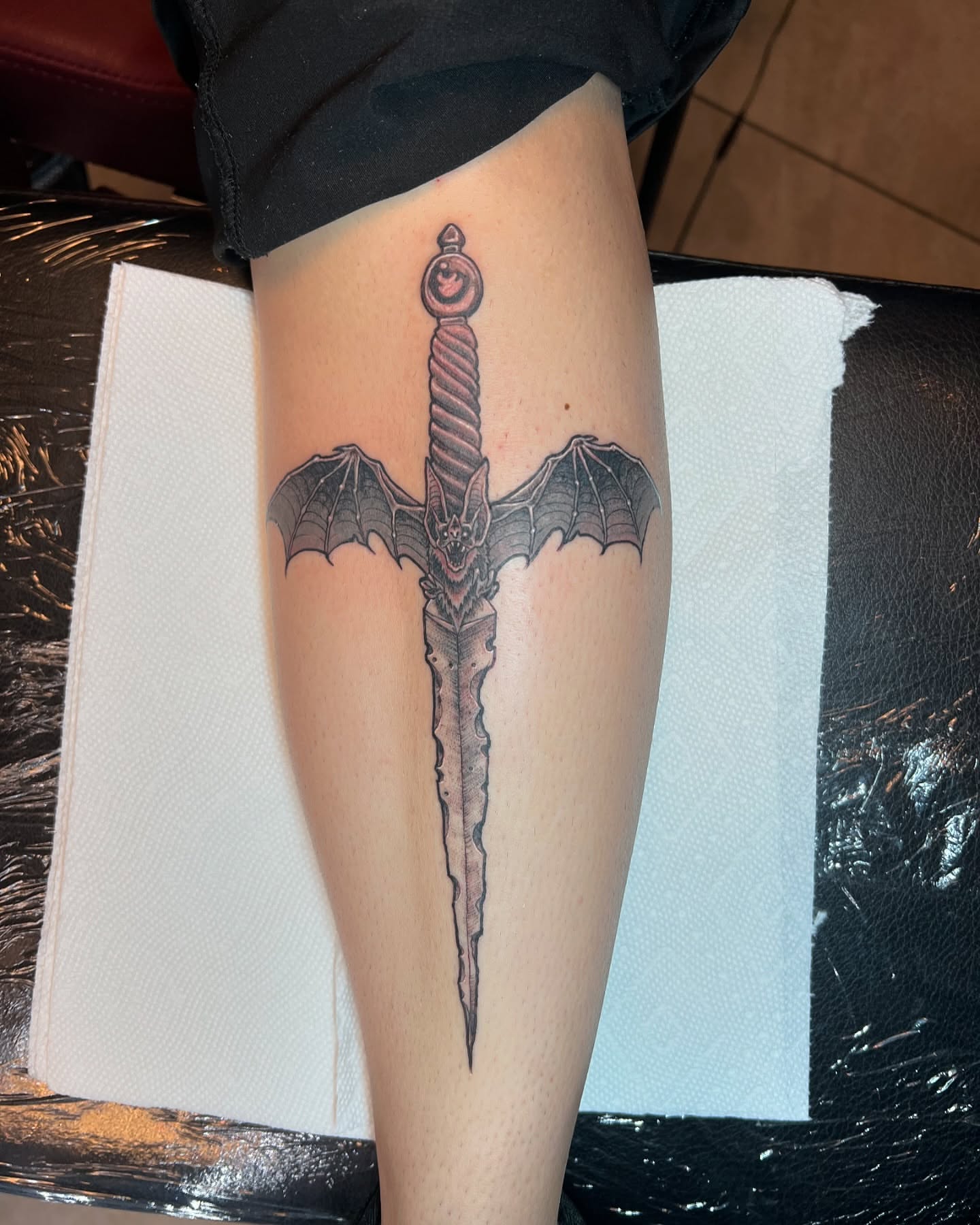 Bat sword dark realism tattoo on the leg by Vincent C DiBiaso, Covington, Kentucky