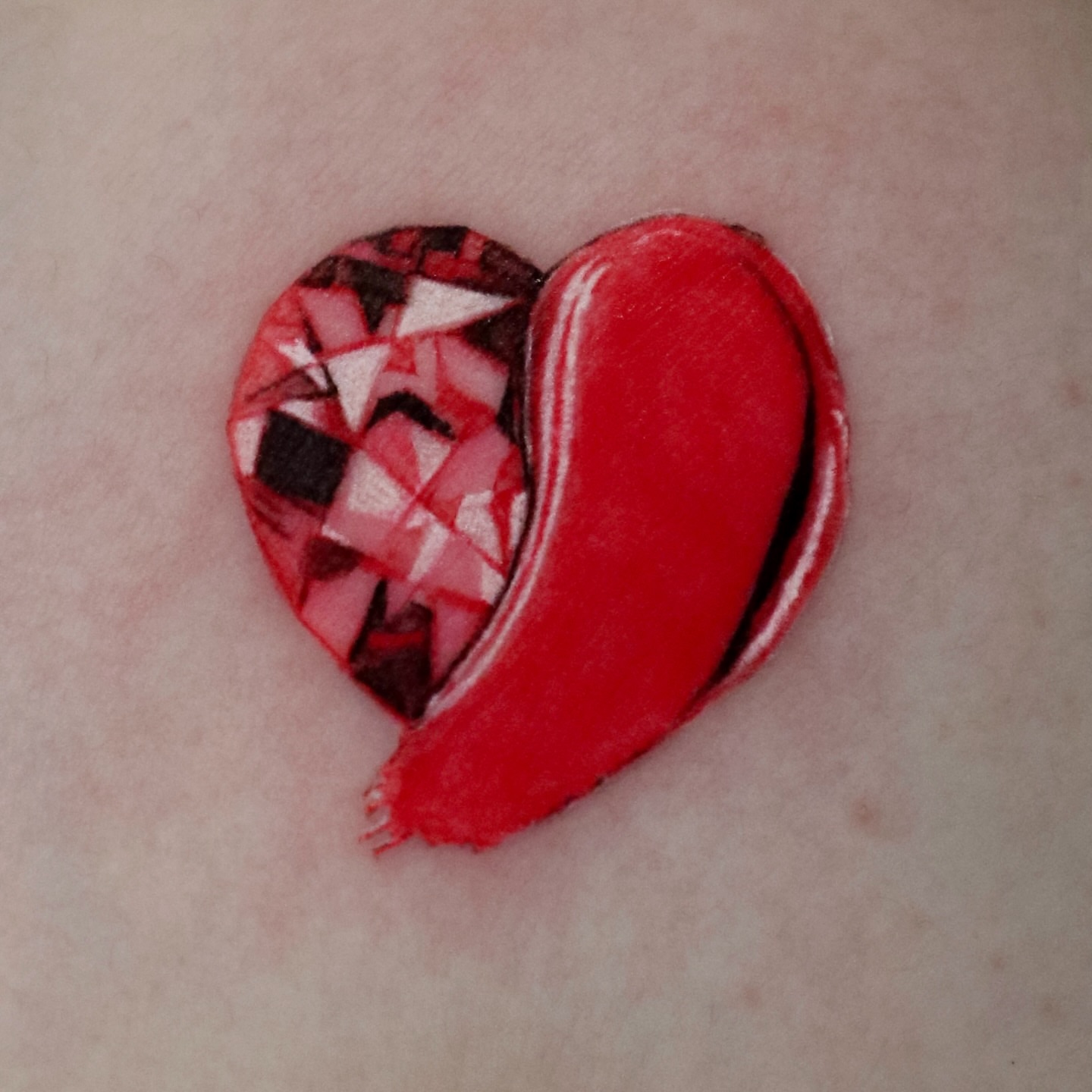 Heart geometric tattoo on the forearm by Greeni