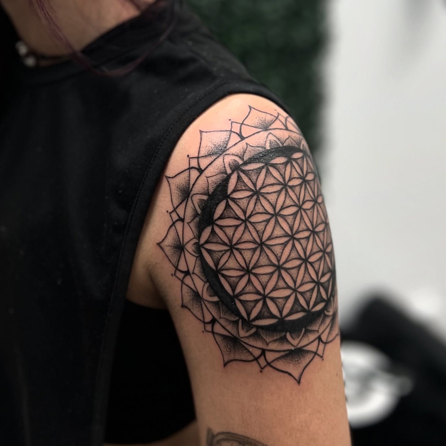 Flower of life geometric tattoo on the shoulder by Syd Cheyenne