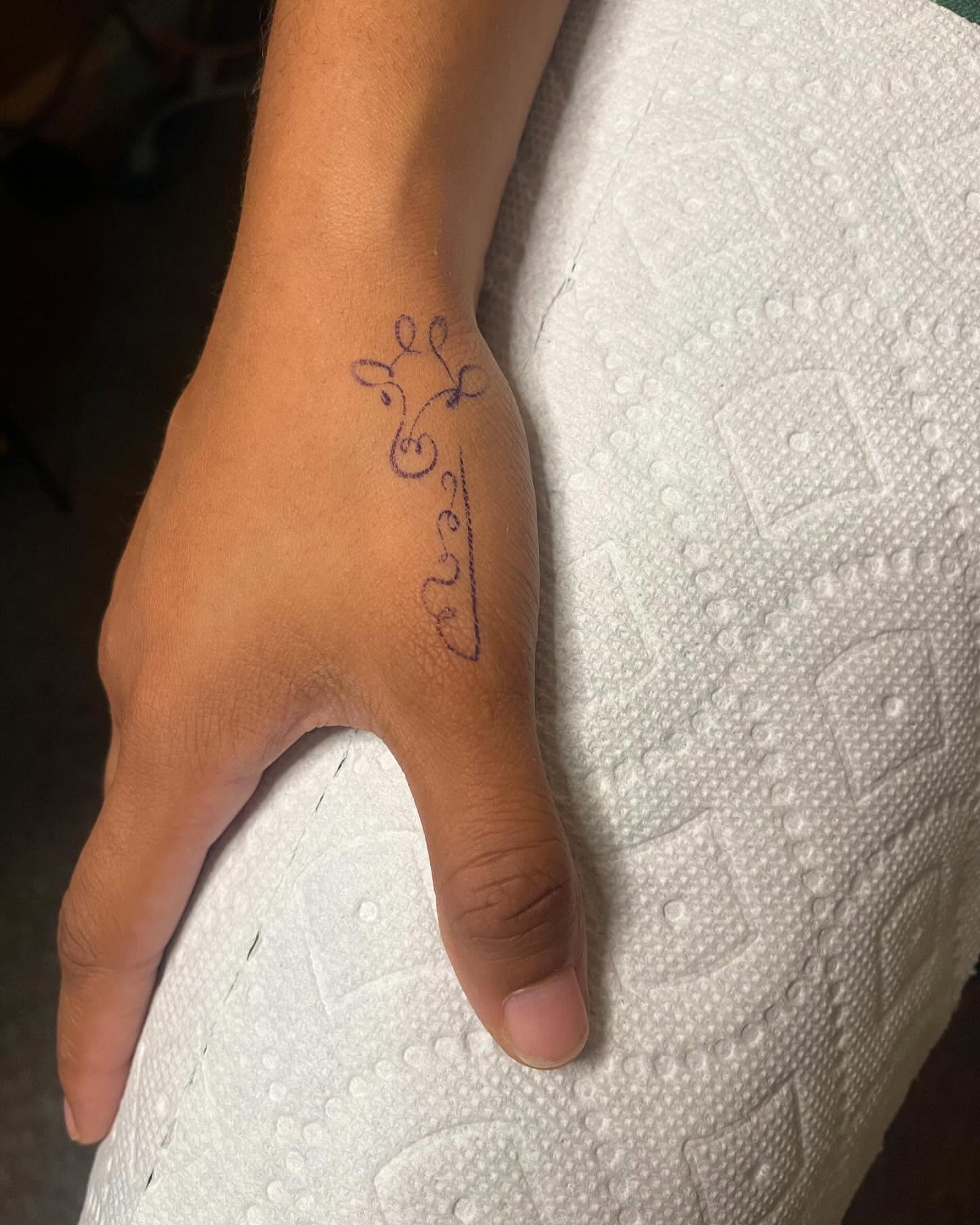 Abstract design fine line tattoo on the hand by Danny Garcia
