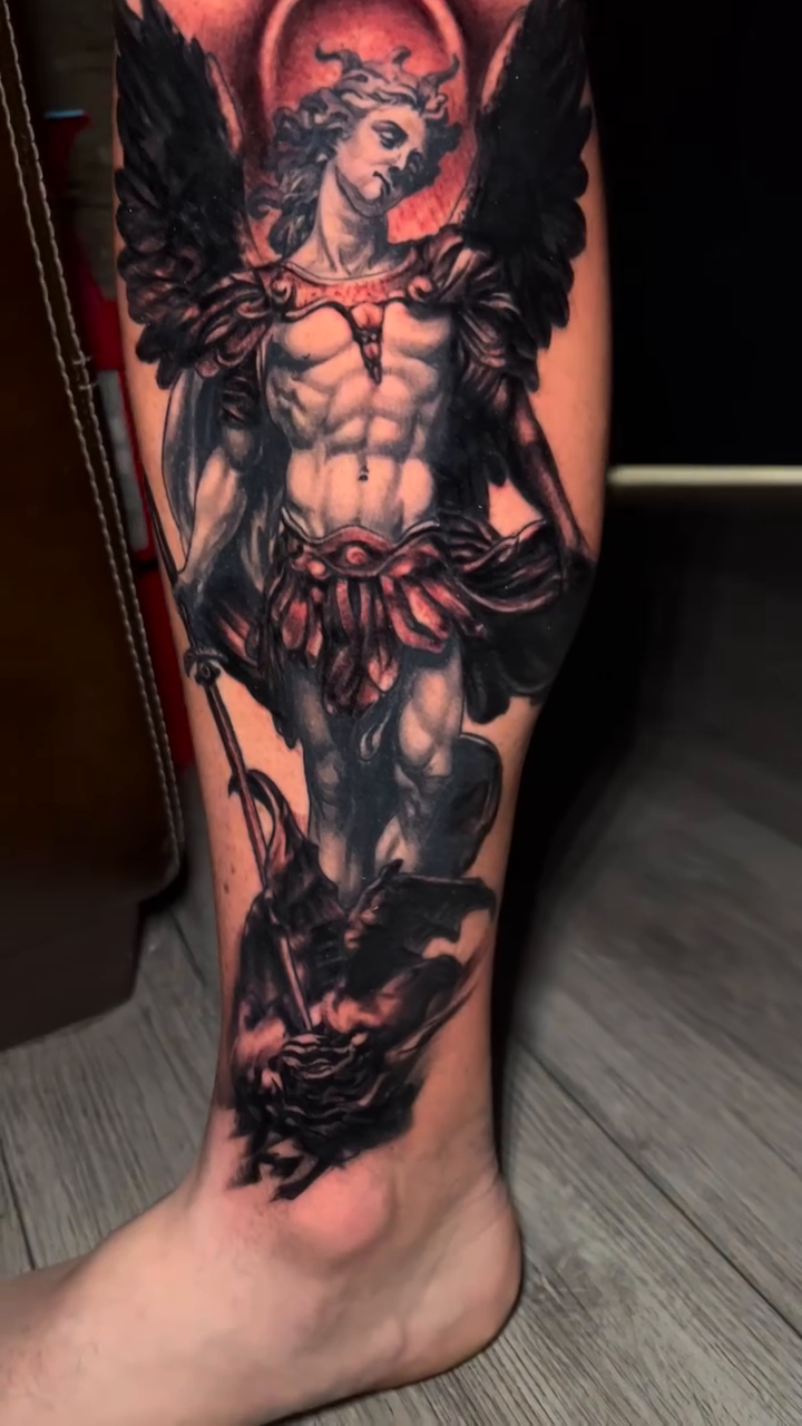 Archangel Michael battling a demon realism tattoo by Raul Ugarte, Roseville, California