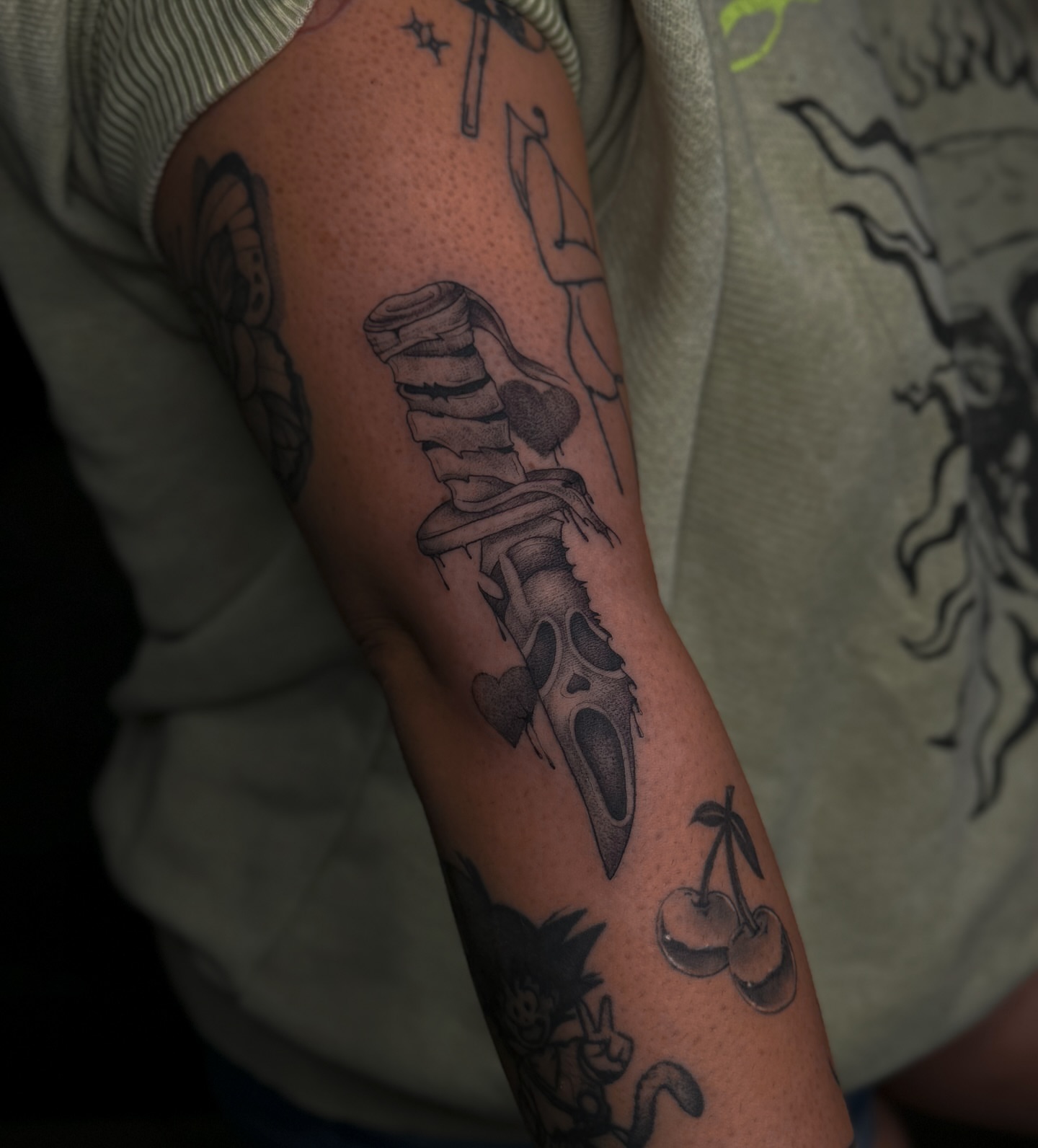 Knife and heart realism tattoo on the forearm by Dee, San Diego, California