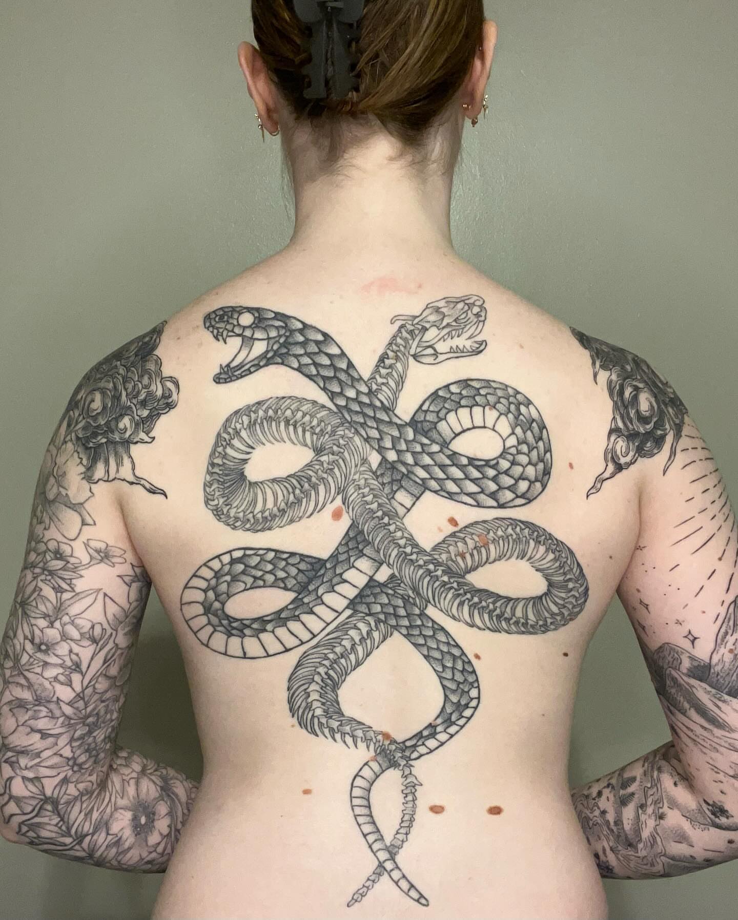 Snake black and grey tattoo on the back by Marissa Losier