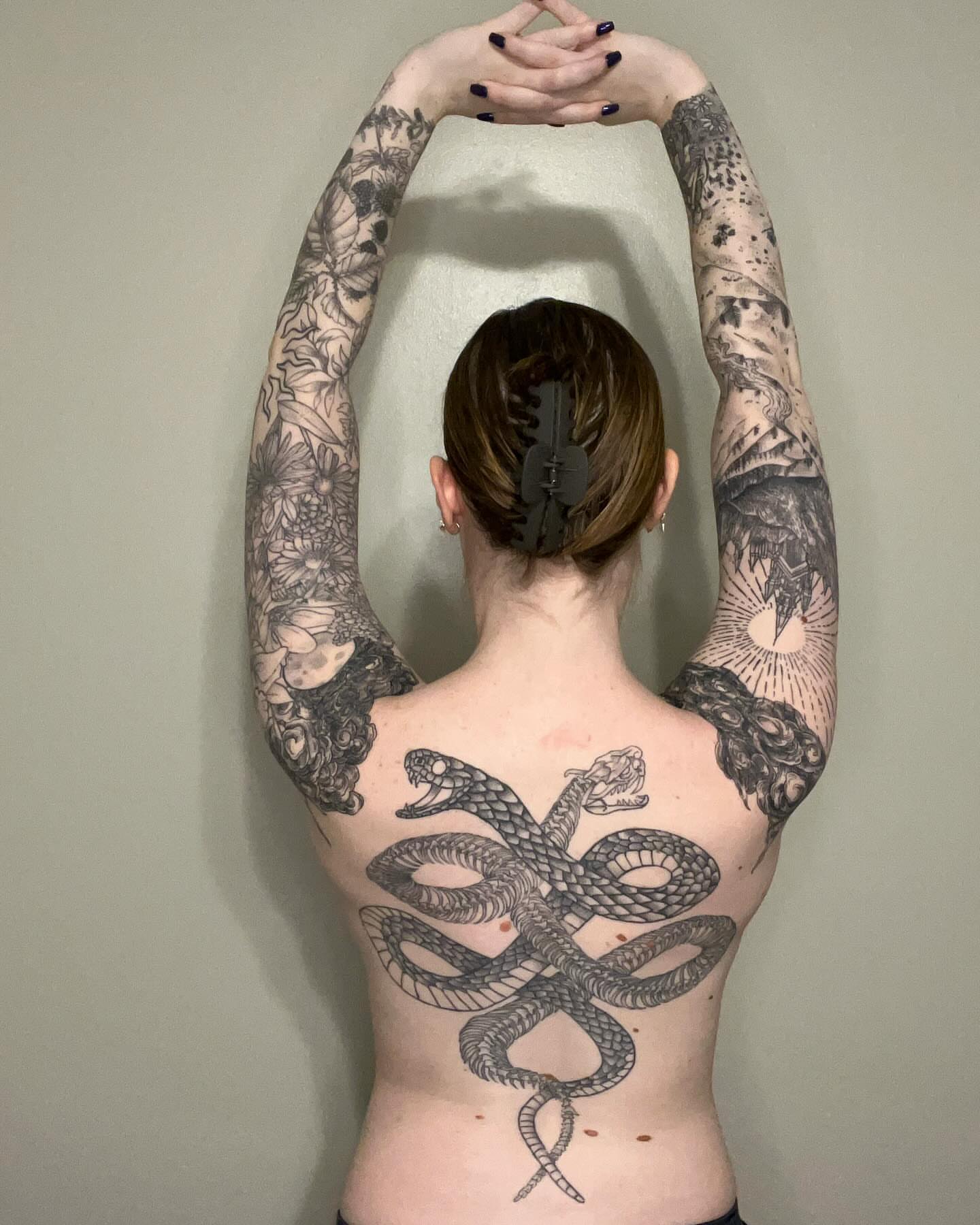 Snake black and grey tattoo on the back by Marissa Losier