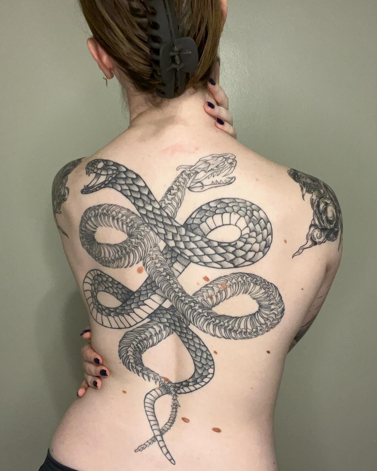 Snake black and grey tattoo on the back by Marissa Losier