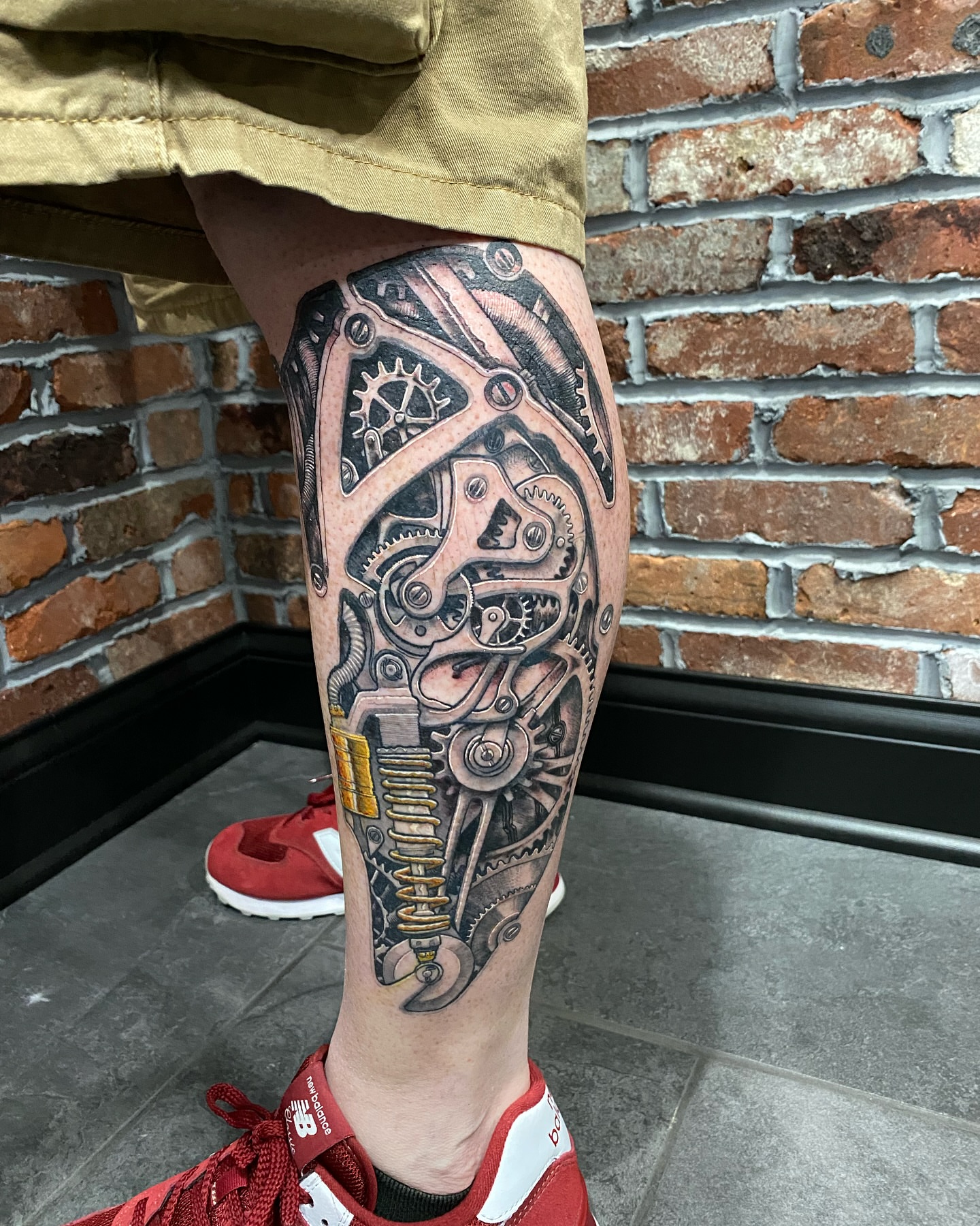 Mechanical gears geometric tattoo on the calf by Vincent C DiBiaso, Covington, Kentucky