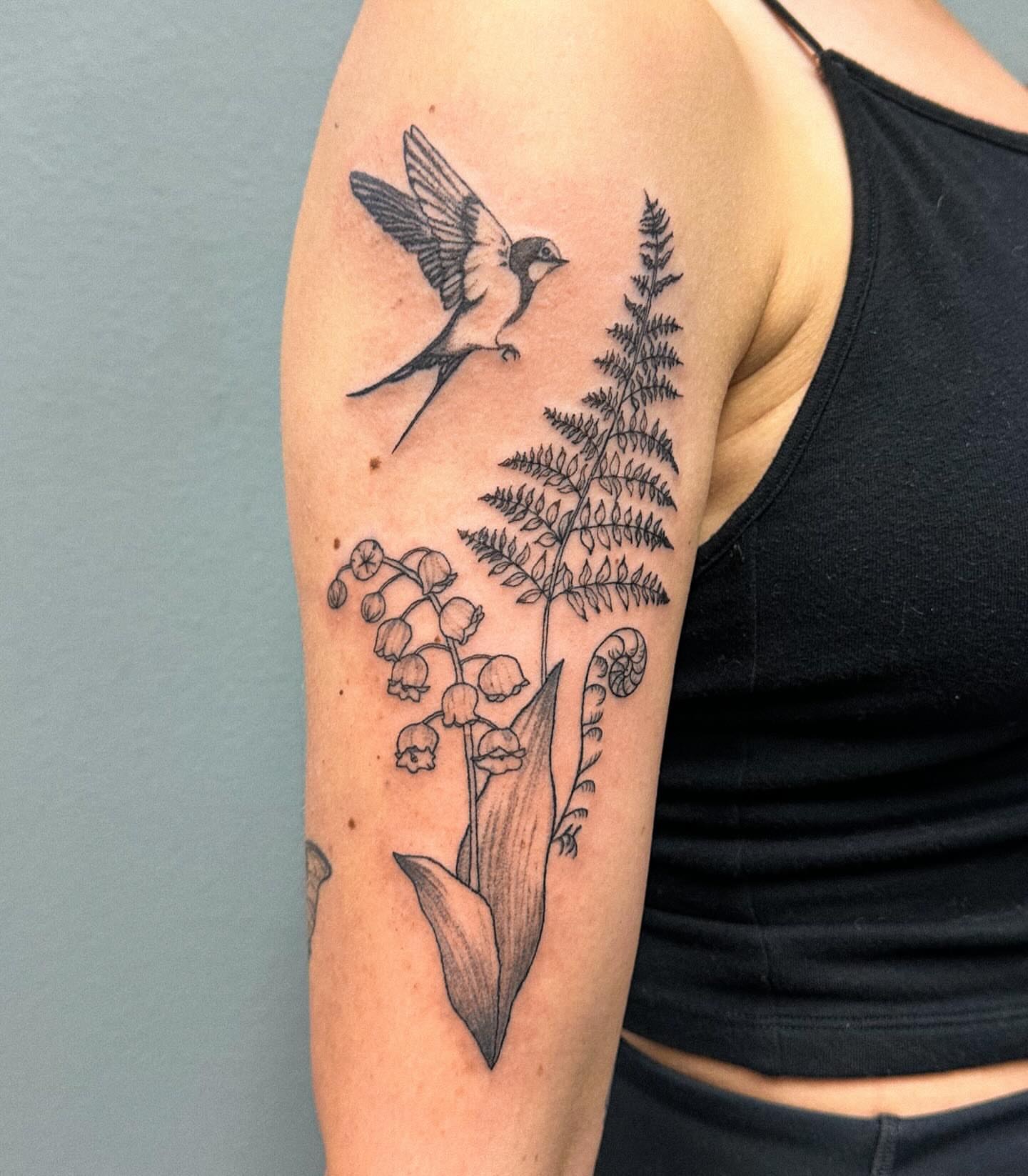 Bird and fern realism tattoo on the forearm by Portland Tattoo Artist