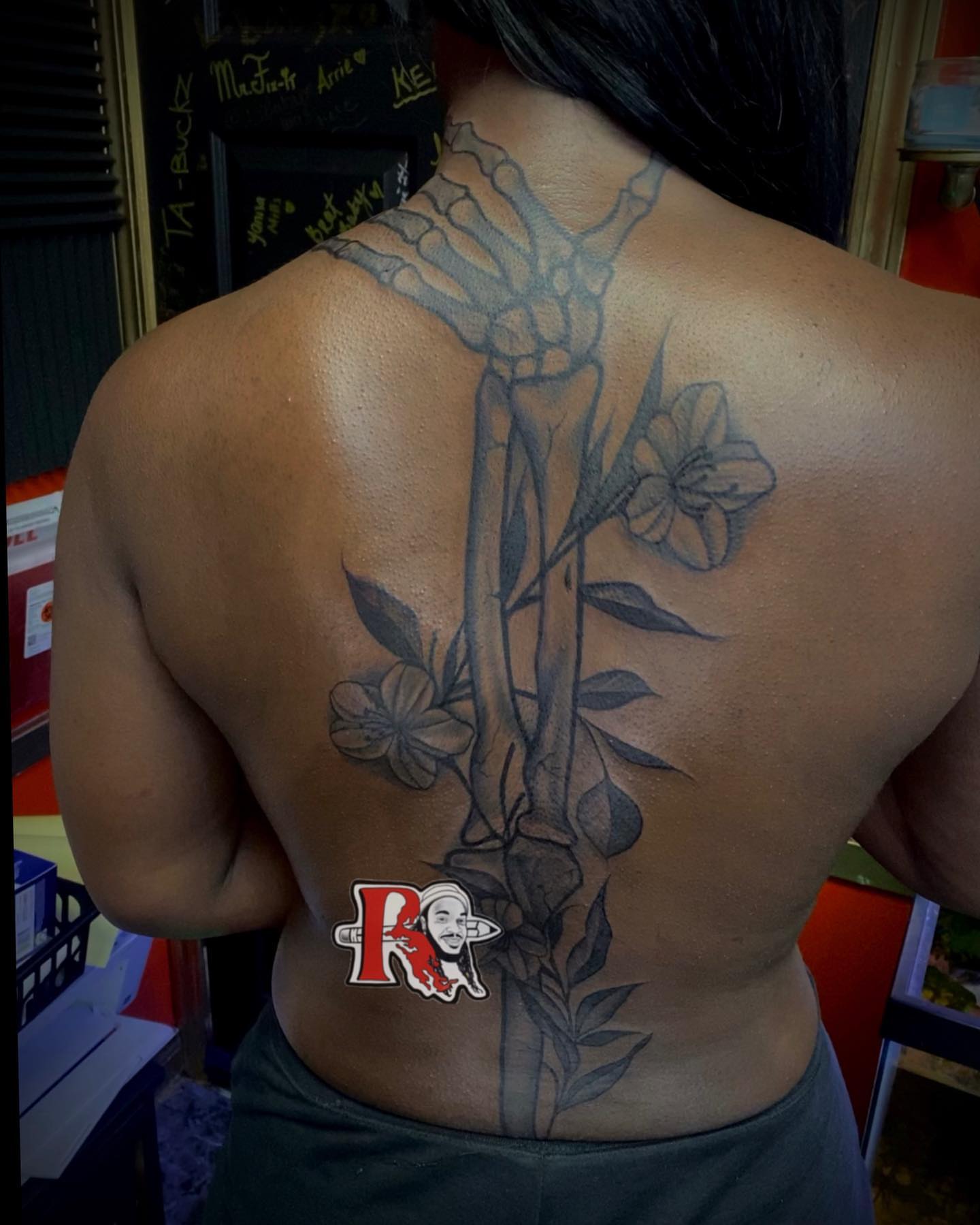 Flower and skeleton realism tattoo on the back by Chicago Tattoo Artist