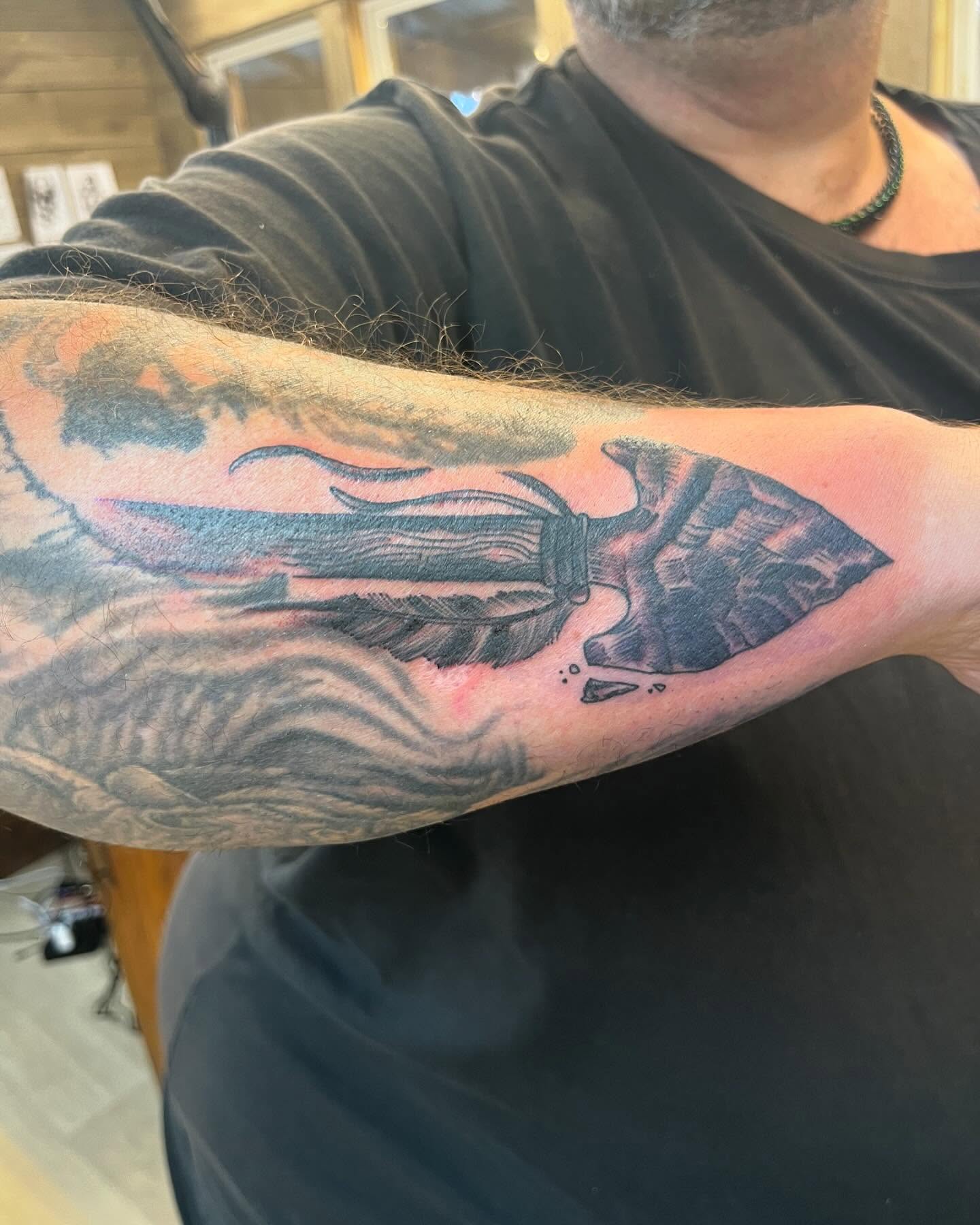 Knife and flames black and grey tattoo on the forearm by Izzi 🧿 Htx