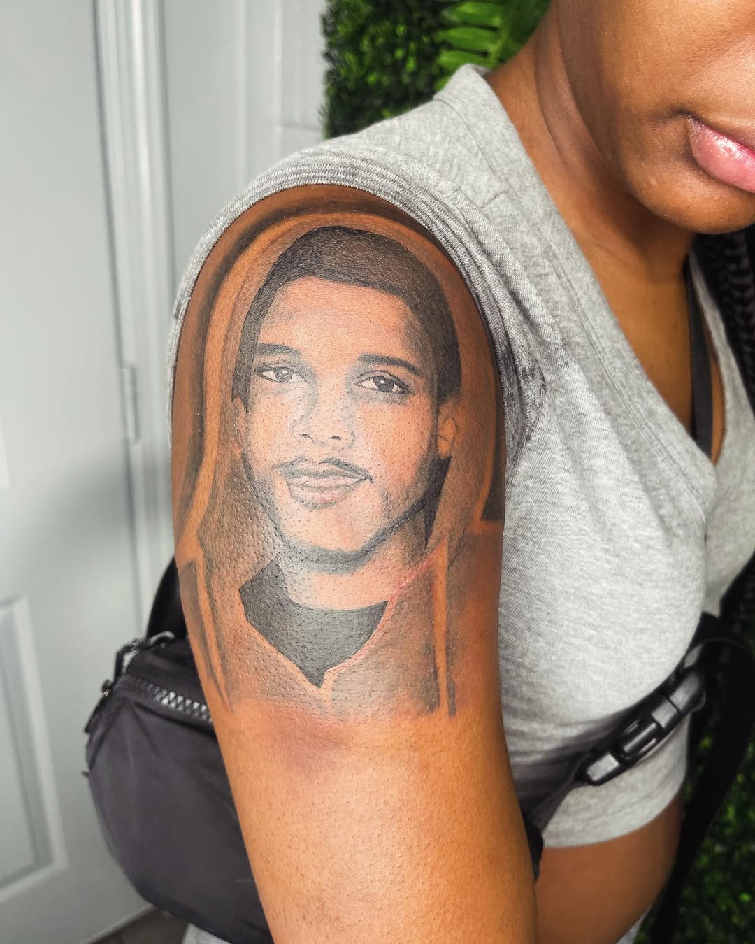Portrait of a man realism tattoo on the upper arm by Uncle Fade Tattoo Artist ✍🏾